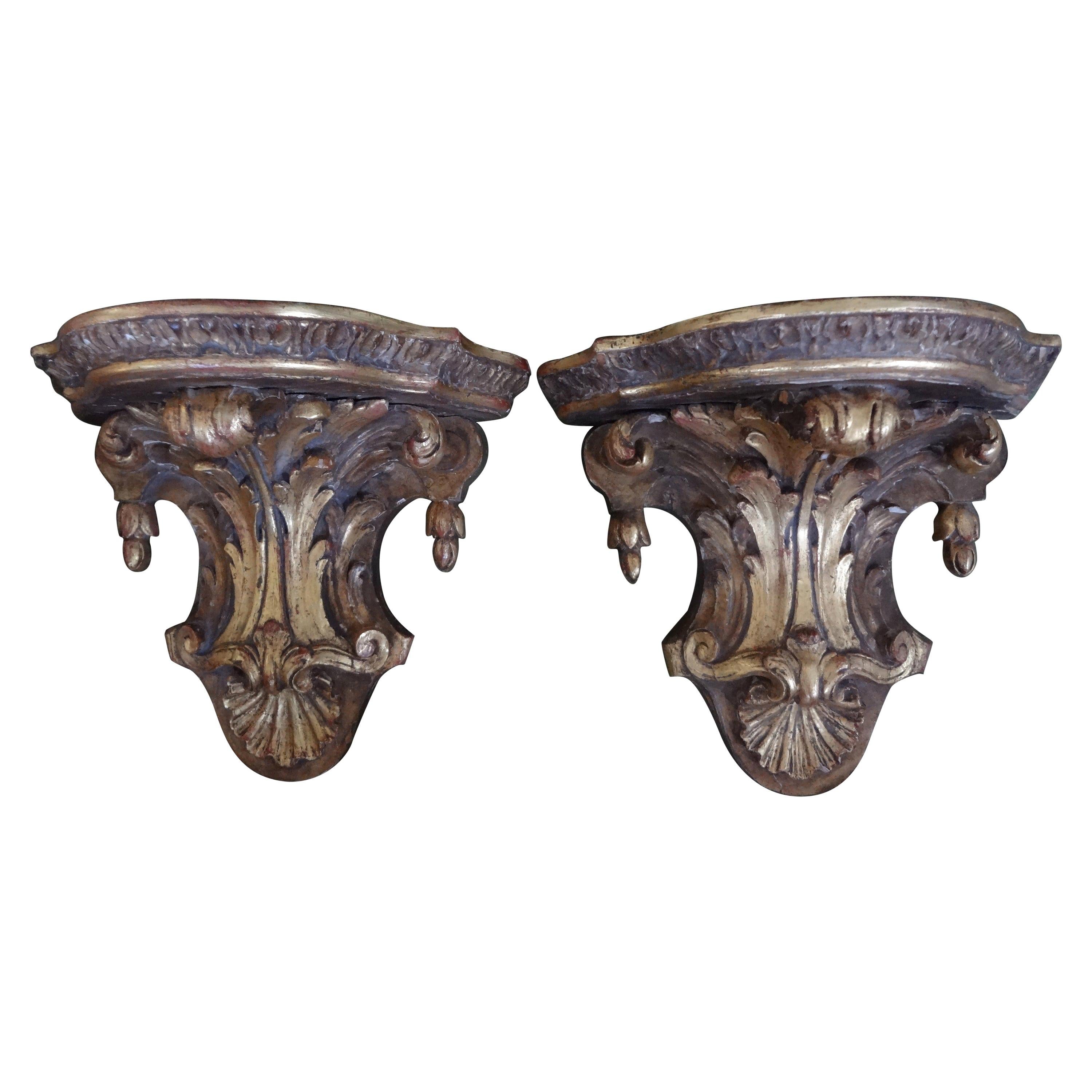 Stunning pair of 19th century or earlier Italian or French Regence style giltwood wall brackets. This pair of gilt wood wall brackets are in great shape with fabulous patina to the gilt. Extra large top surface area (15.13
