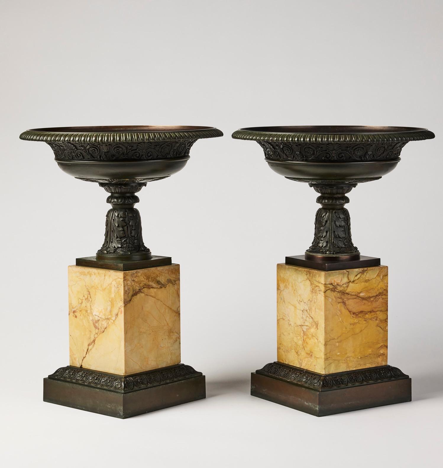 A pair of early 19th century Italian Grand Tour patinated bronze and sienna marble tazzas. A very nice and large pair of an unusual model having no side handles or side fixture decoration. Finely cast and with high quality detailing. Ca. 1820-30.