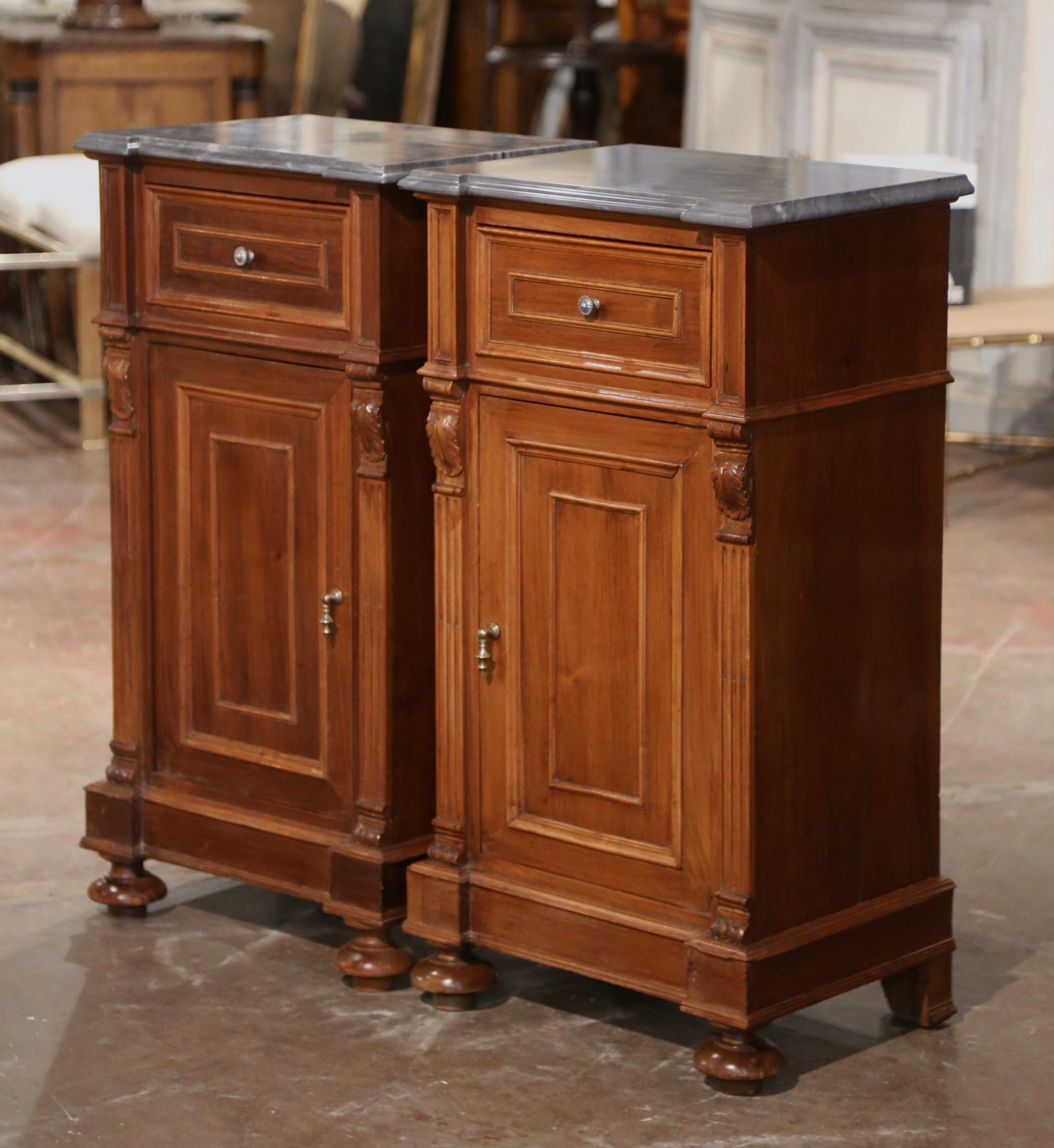 Add surface space in your bedroom with this elegant pair of antique nightstands. Crafted near Genoa, Italy circa 1870, each cabinet built of walnut, stands on bun feet over a straight plinth base; each traditional piece with clean lines features a