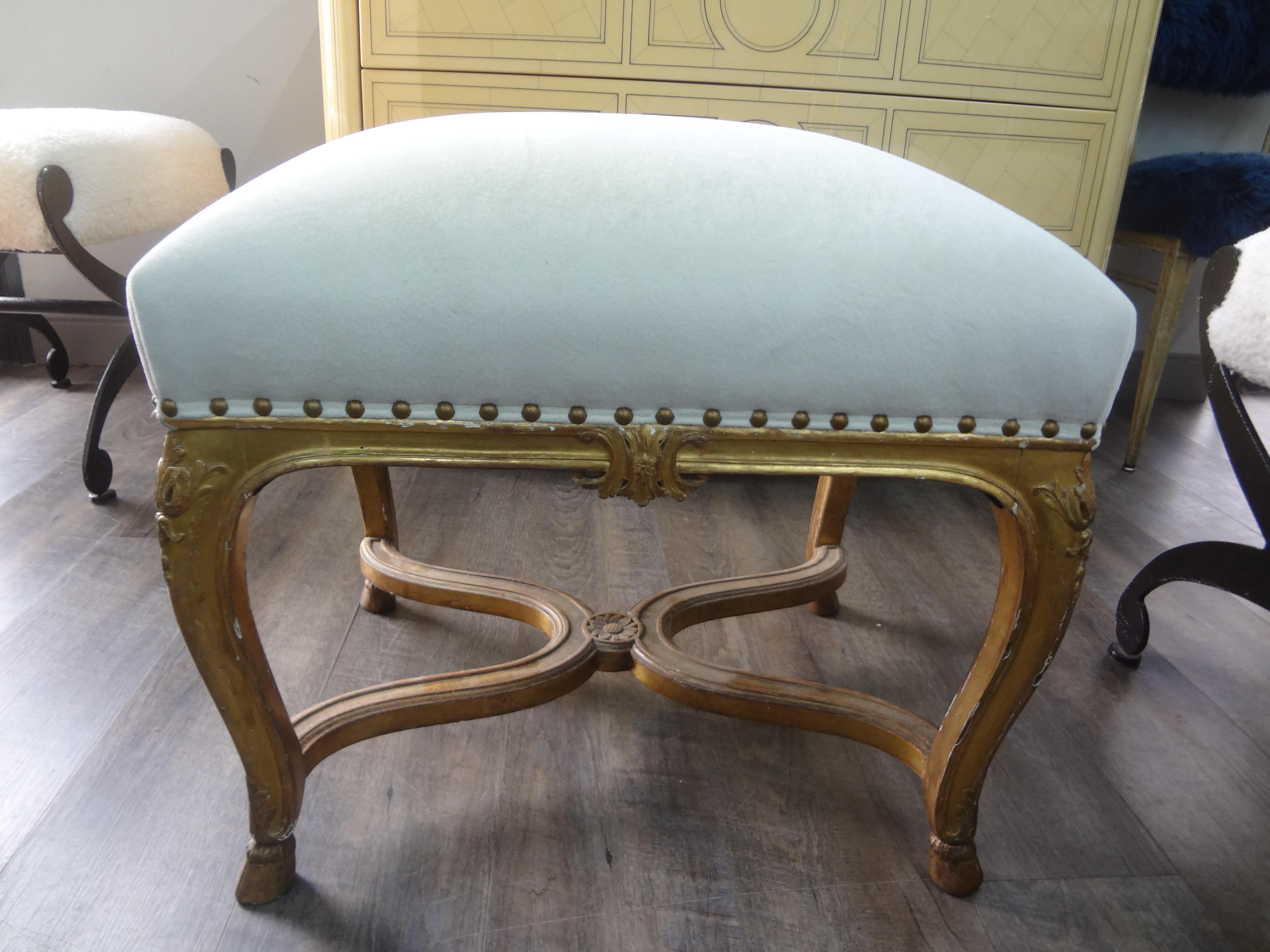 Pair of 19th century Italian Louis xvi style giltwood benches.
This lovely pair of large antique Italian giltwood benches, ottomans, or stools are substantial and large enough for extra seating. These beautiful Italian giltwood benches have been