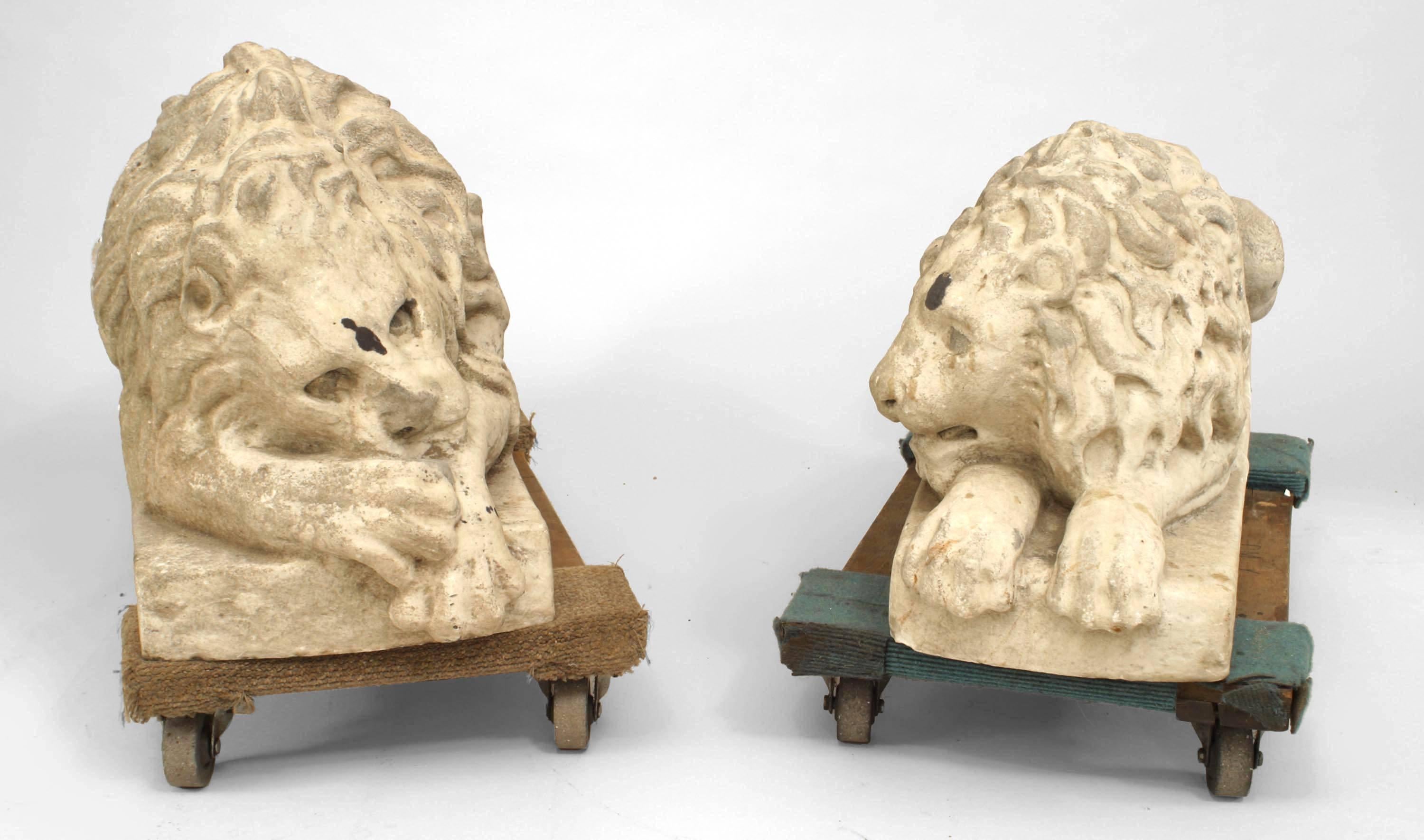 Pair of Outdoor Italian (early 19th Cent) white marble figures of two reclining lions resting on a rectangular base
