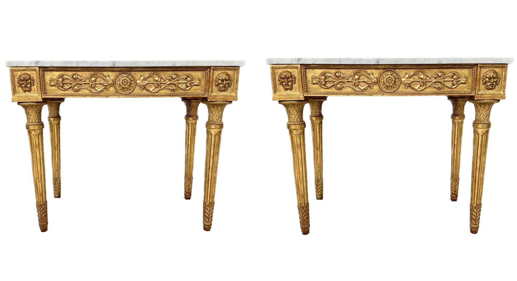 Very fine pair of Italian neoclassical style giltwood console tables with white Carrara marble tops. Bases feature a giltwood paneled frieze carved with roundels applied with flowerheads with egg-and-dart moulding. Each corner with applied giltwood