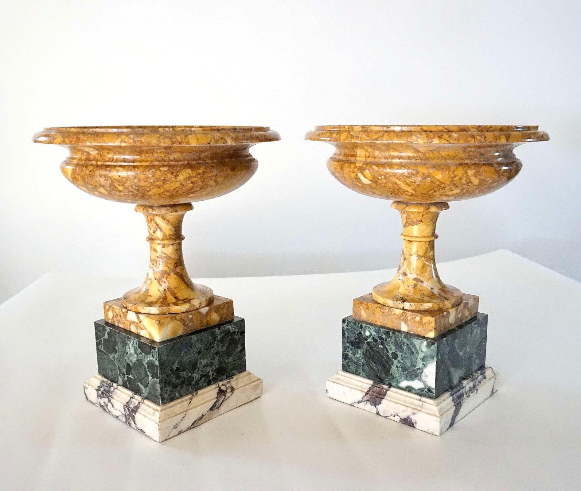 Pair of 19th century Italian 'grand tour' tazze or shallow urns of neoclassical form composed of ancient Roman marbles; the tazze having round giallo antico bowls and socles on square verde antico and pavonazzetto plinths.  Height of tazze alone is