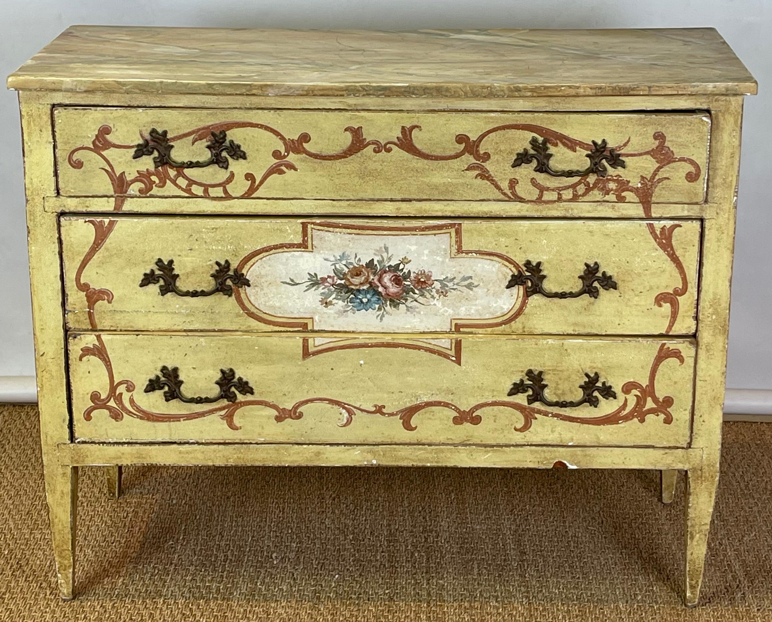 A matched pair of early 19th C. Italian polychrome decorated three-drawer Italian commodes or chests with faux marble tops on square tapering legs.