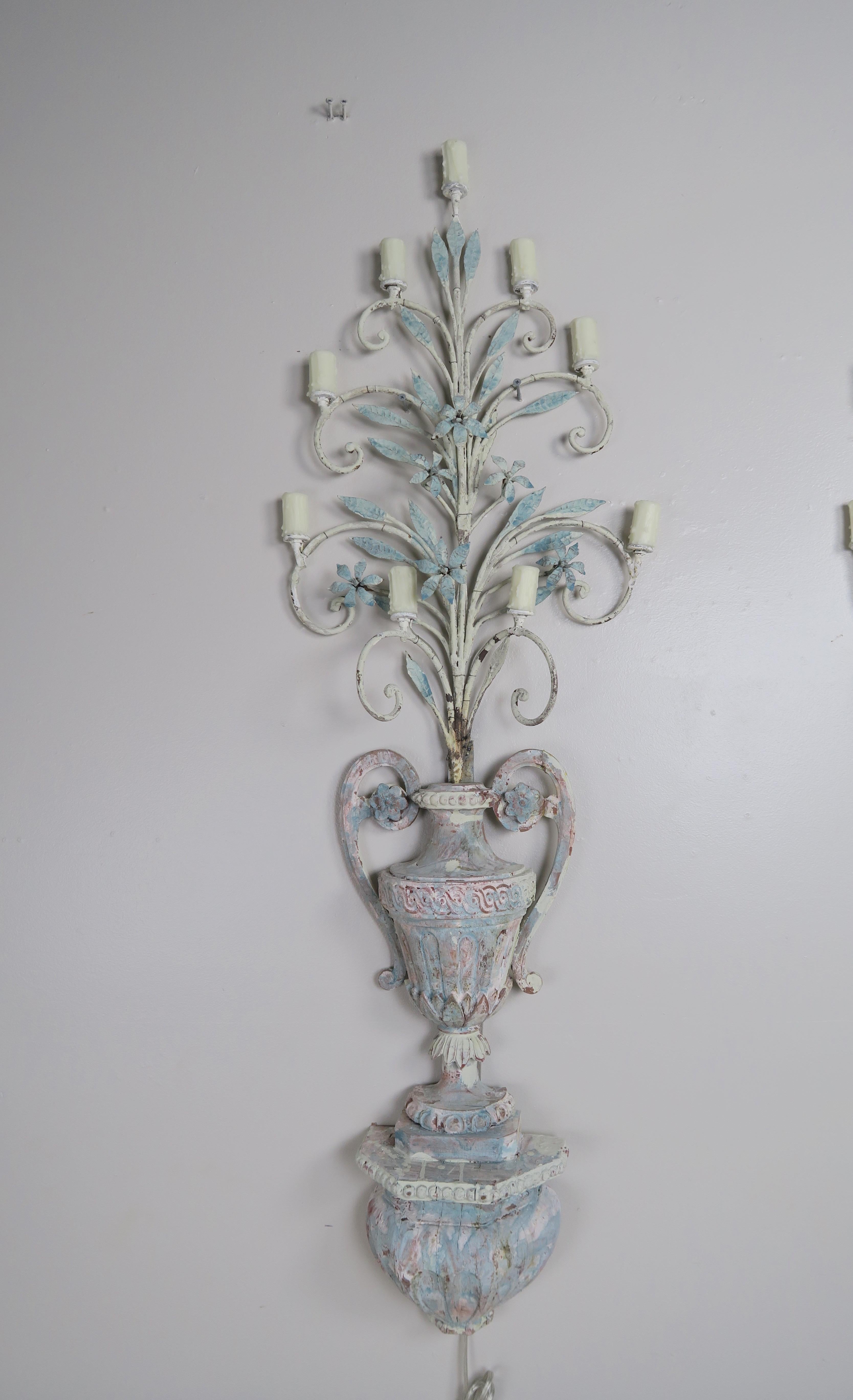 Pair of 19th century Italian painted 9-light sconces. The sconces were originally meant to hold candles. The urns are hand carved and painted in a soft French blue/gray coloration. Wrought iron branches extend from both urns depicting nine lights