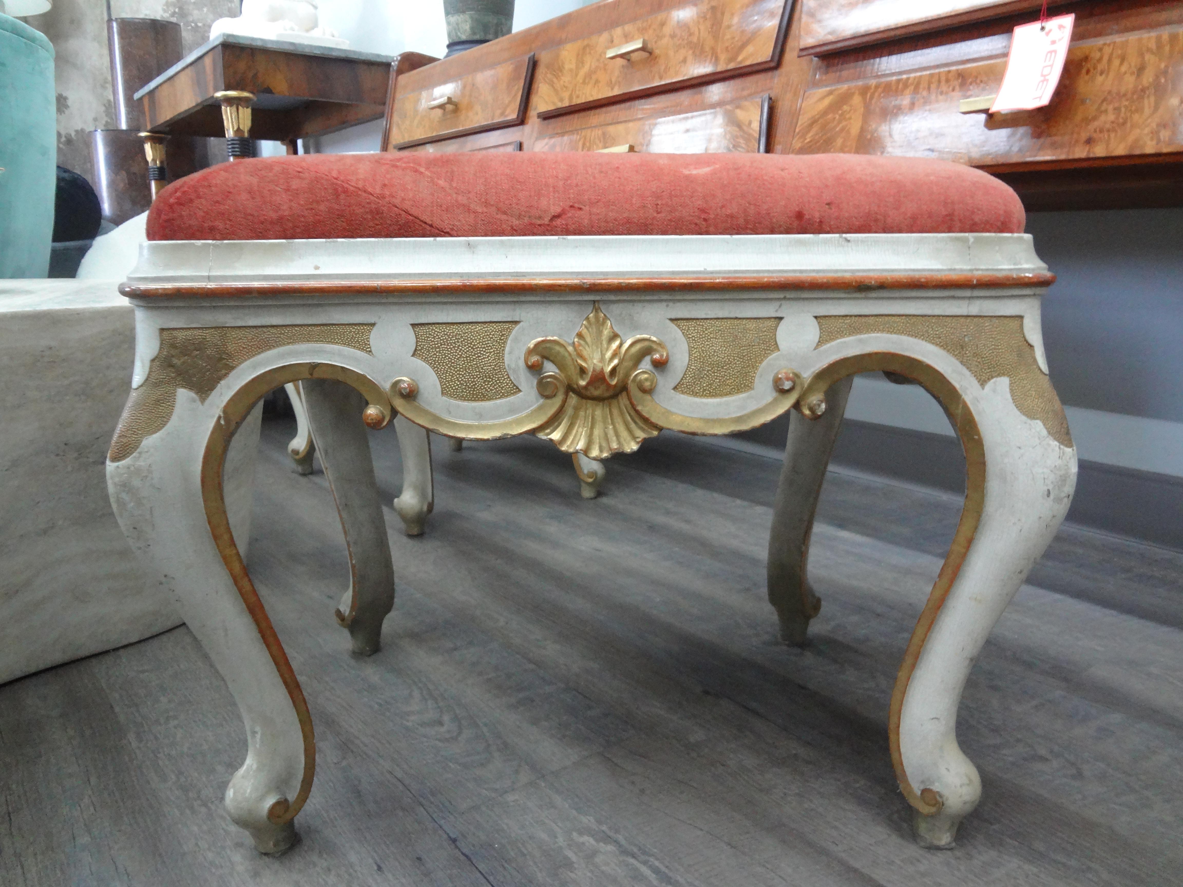 Pair of 19th Century Italian Painted and Parcel Gilt Ottomans.
This listing is for a large pair of antique Italian painted and giltwood ottomans or benches.
This versatile pair of benches, ottomans or stools would look great under a console table or