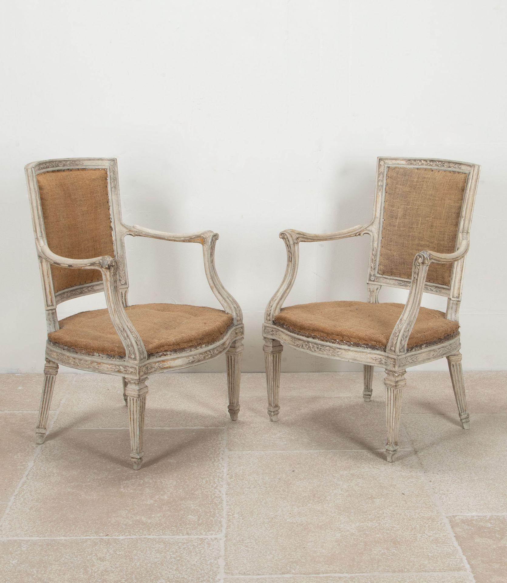 Decorative pair of 19th Century Italian painted armchairs. 
These chairs made in the Louis XVI manner, having rectangular backs with a subtle concave shaping contrasting beautifully with the bowed front seat rails. The terminals of the arms are