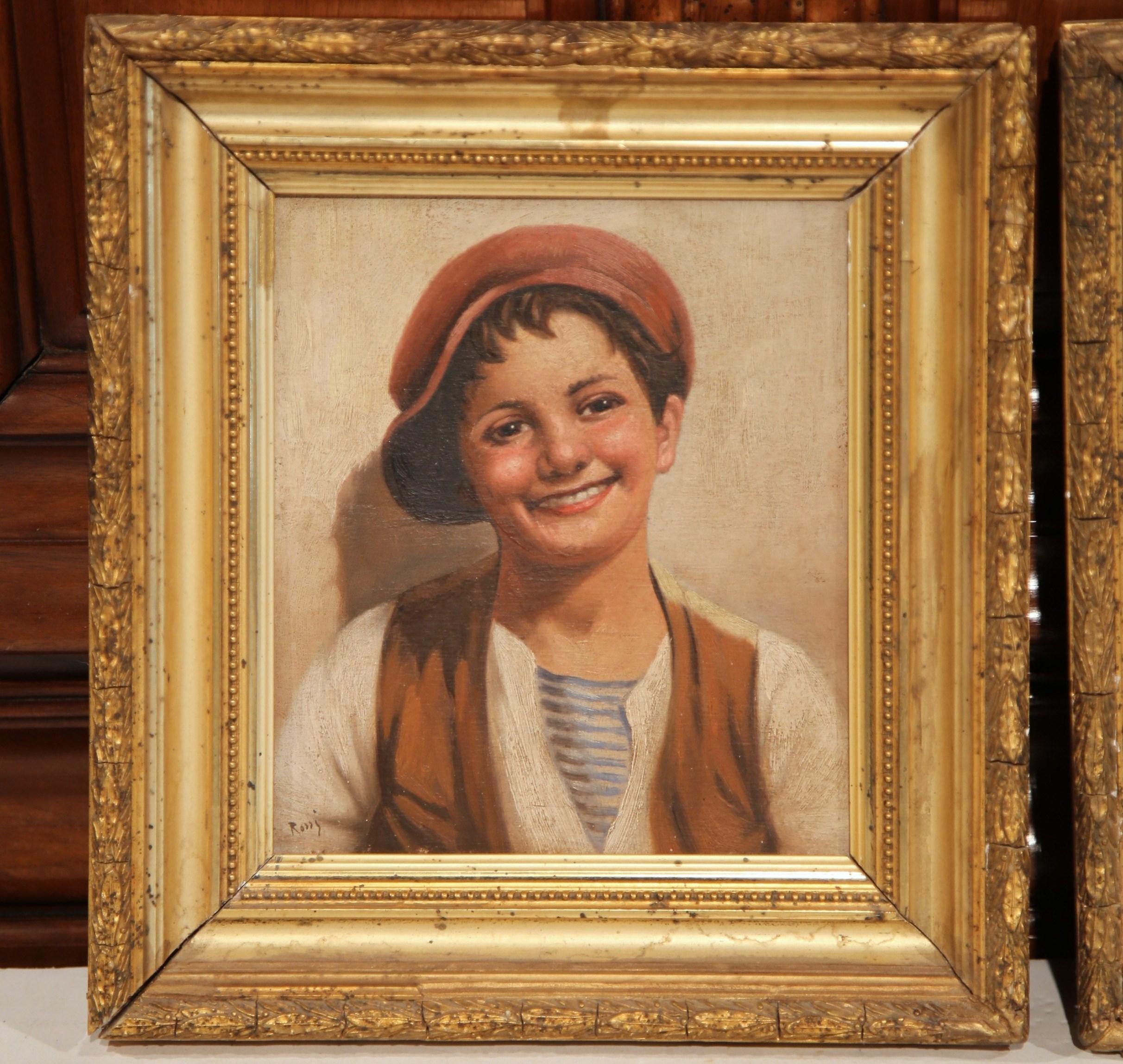 These charming antique paintings on board were painted in Italy, circa 1870. The portraits set inside carved gilt frames, and signed in the lower left by the artist Rossi, feature a pair of Neapolitan youngsters in traditional outfits. The