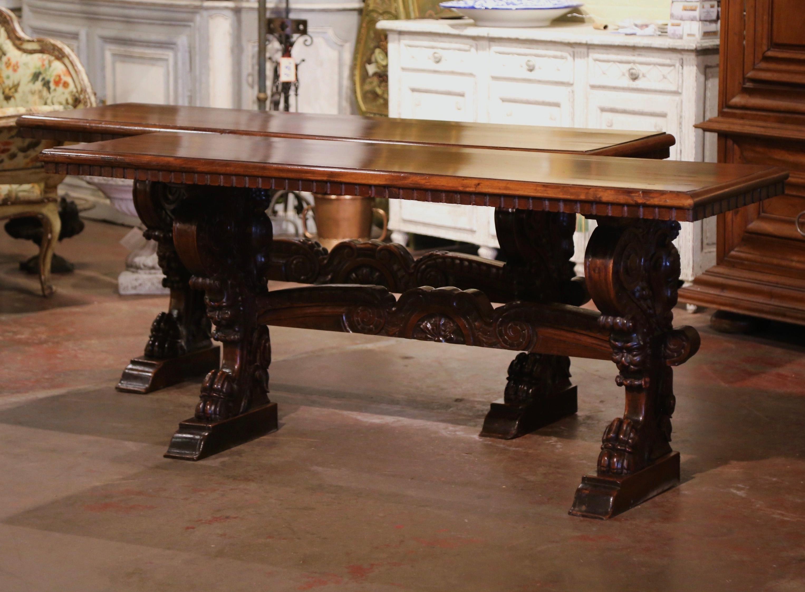 Bring the Italian elegance in your home with this important pair of antique Renaissance console tables. Crafted in Italy circa 1850 and over six feet long, each trestle table built of solid walnut, stands on carved pedestal legs ending with paw feet