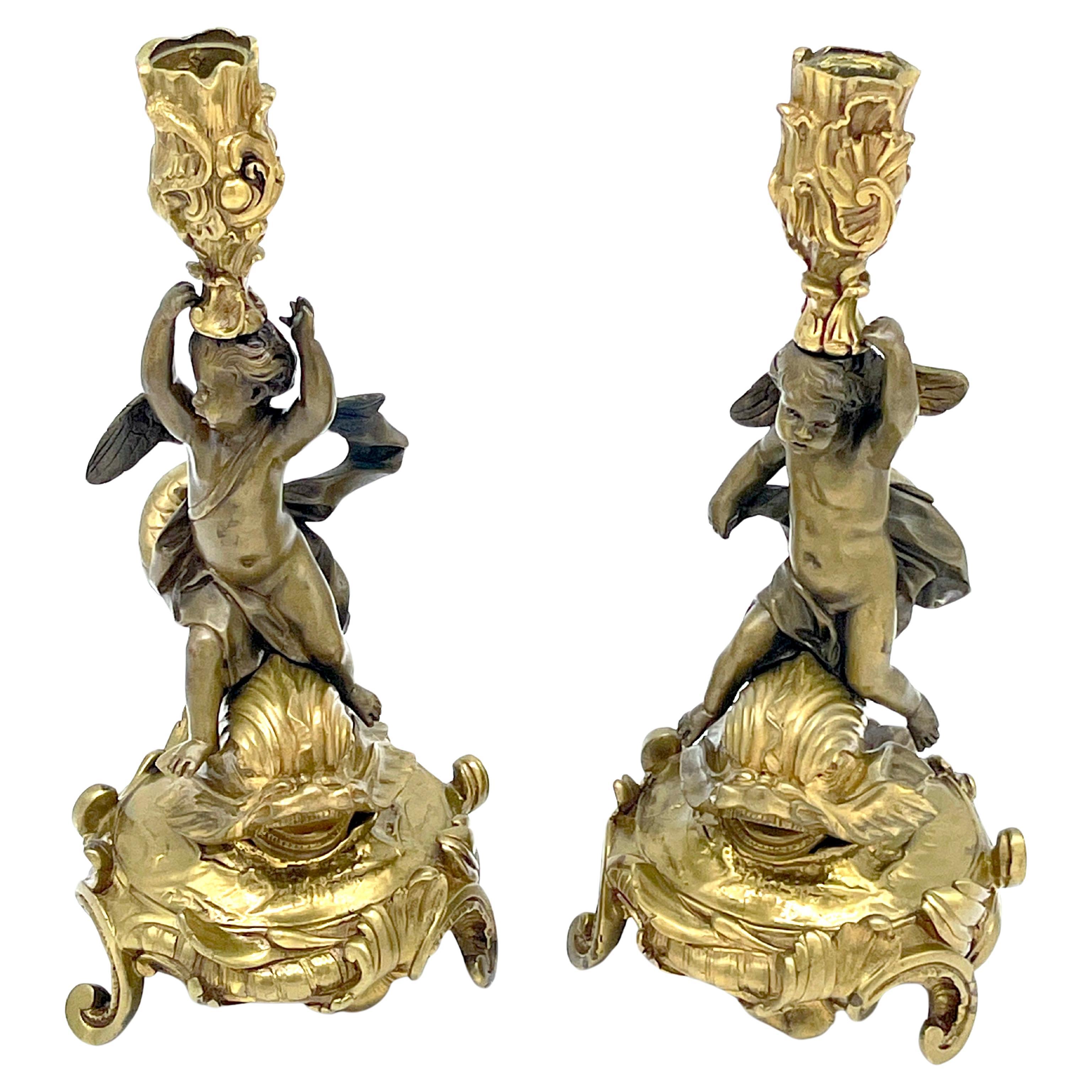 Pair of 19th Century Italian Rococo Style Bronze Putti on Dolphin Candlesticks 