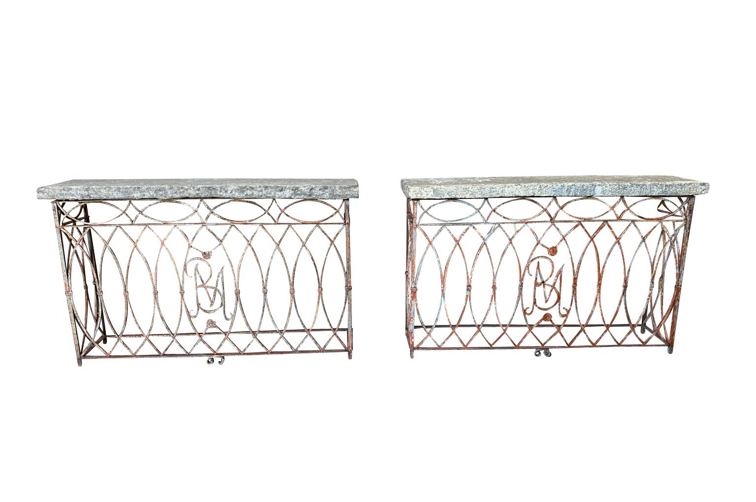 An exquisite pair of 19th century Italian console tables constructed from a stunning balcony grilles with fabulous very thick stone top. Wonderful quality. Perfect for any interior or exterior environment.