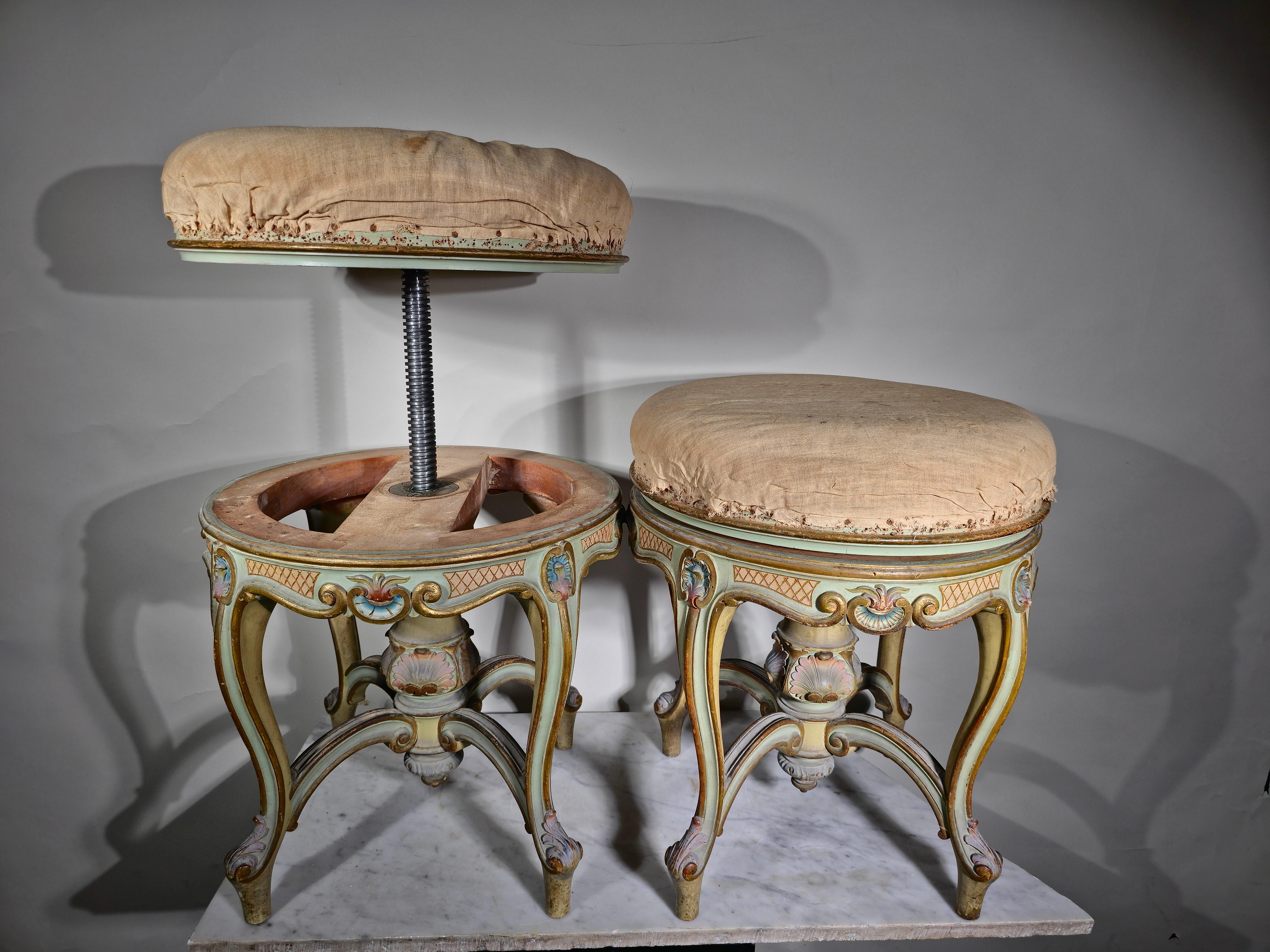 Enhance your living space with this captivating pair of Italian-Venetian stools from the 19th century. These stools, with differing heights, retain their original hand-painted designs, adding an intriguing touch of history and artistry to your