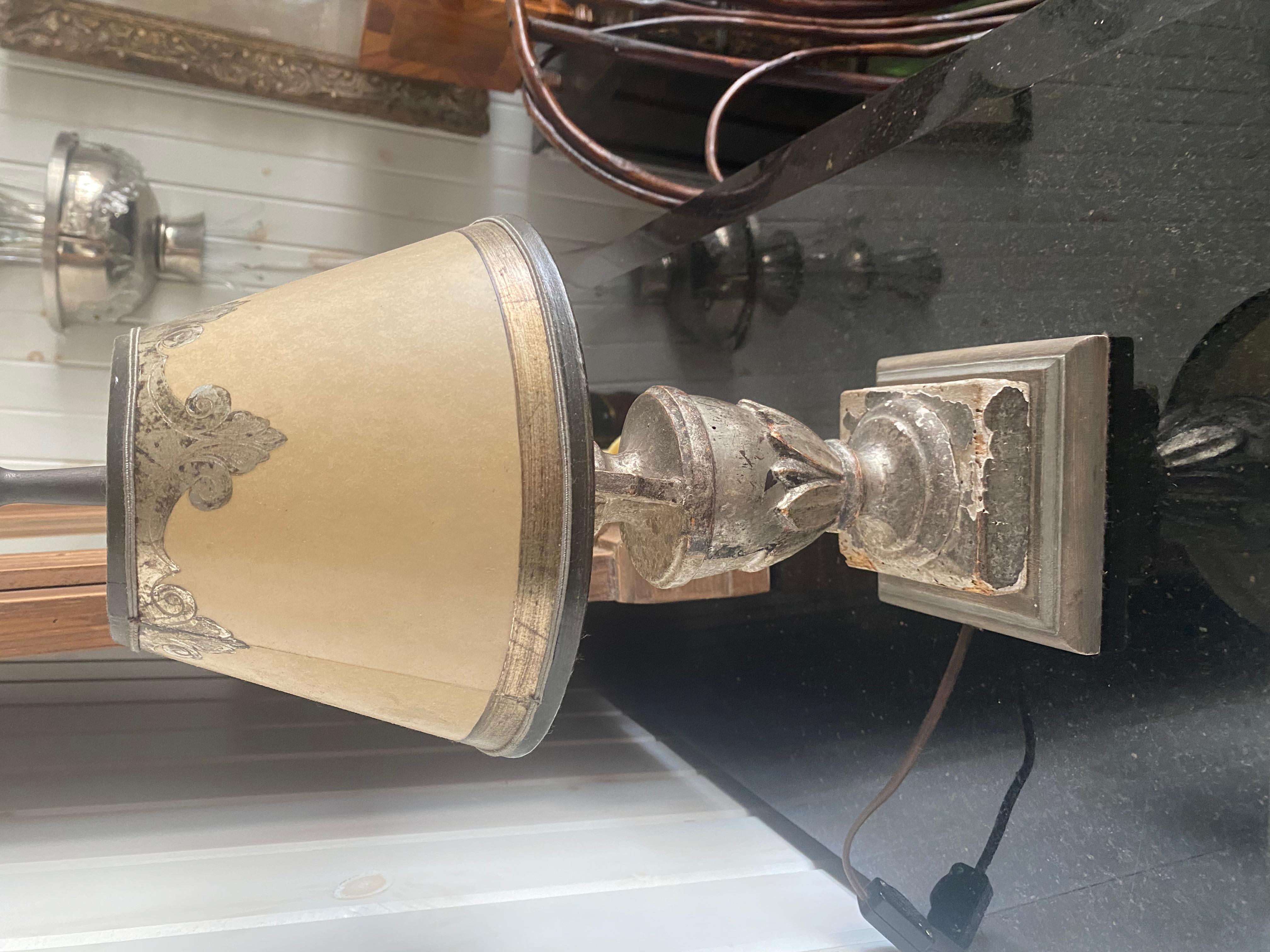 Charming pair of 19th century Italian urns mounted as lamps with custom shades. Would make a lovely pair of wall sconces sitting on wall brackets.