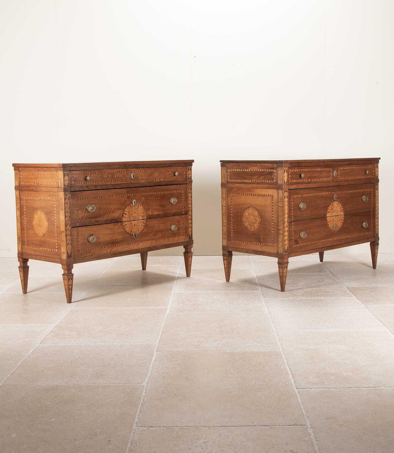 A neat pair of mid-19th Century Italian figured walnut and inlaid commodes. 
Minor differences to the legs and sizes.
Circa 1850.