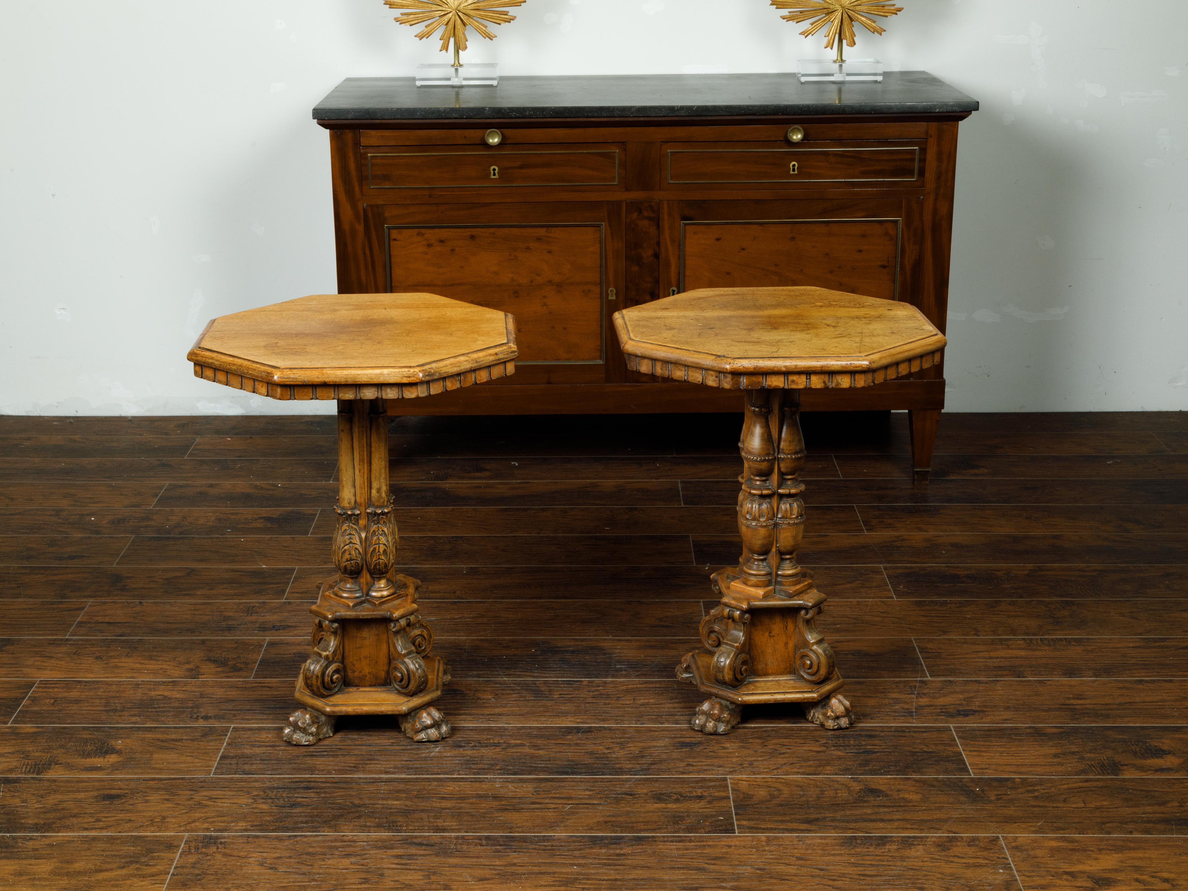 A pair of Italian walnut Guéridon side tables from the 19th century, with octagonal tops, dentil molding and ornate pedestal bases. Created in Italy during the 19th century, each of this pair of walnut Guéridon features an octagonal top boasting a
