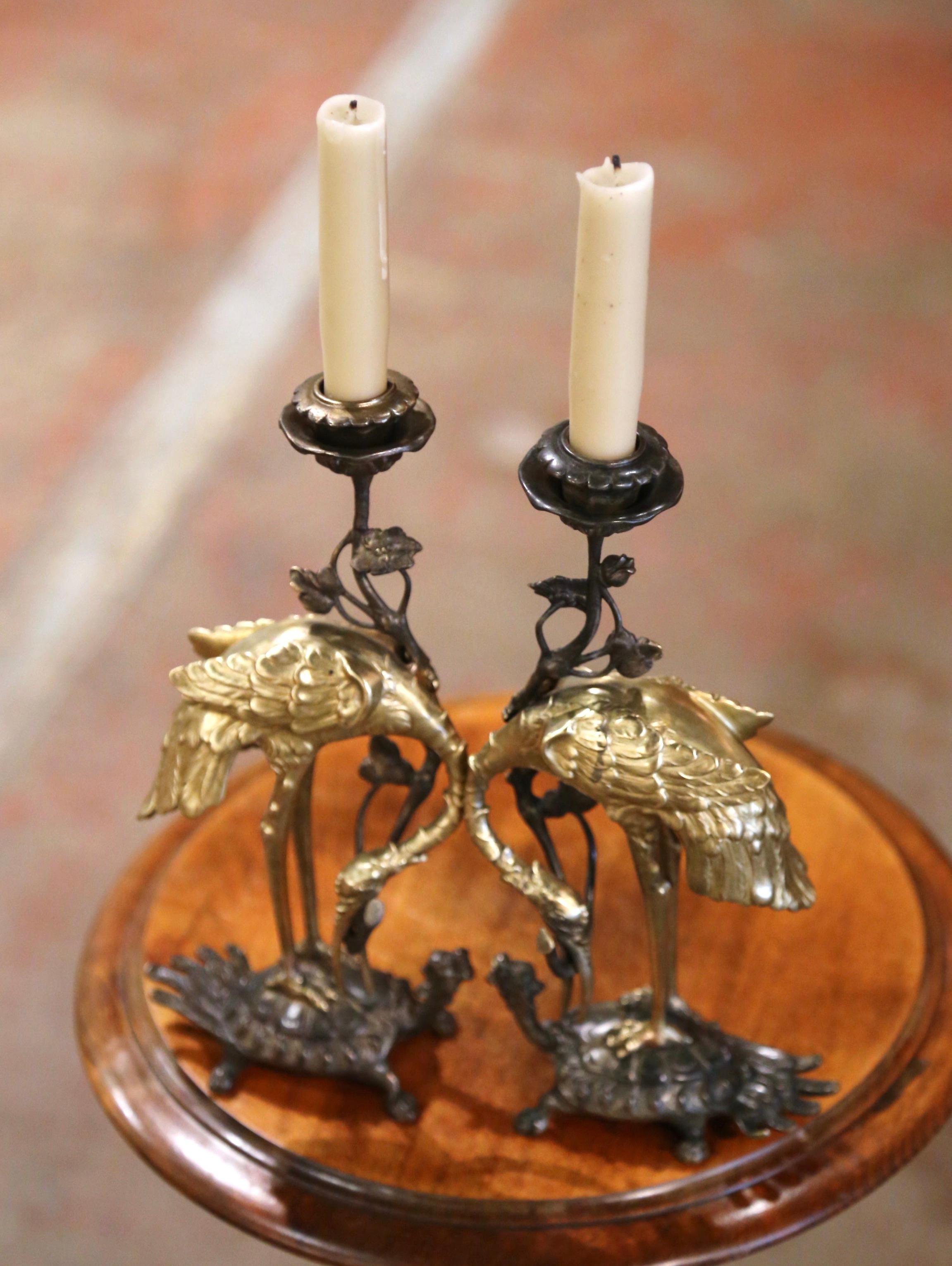 Enhance your space with these captivating Antique Japanese bronze bird and tortoise shokudais. Crafted in Japan in the Meiji period circa 1890, these candlestick holders were traditionally used at Buddhist shrines. The bird, representing a crane,