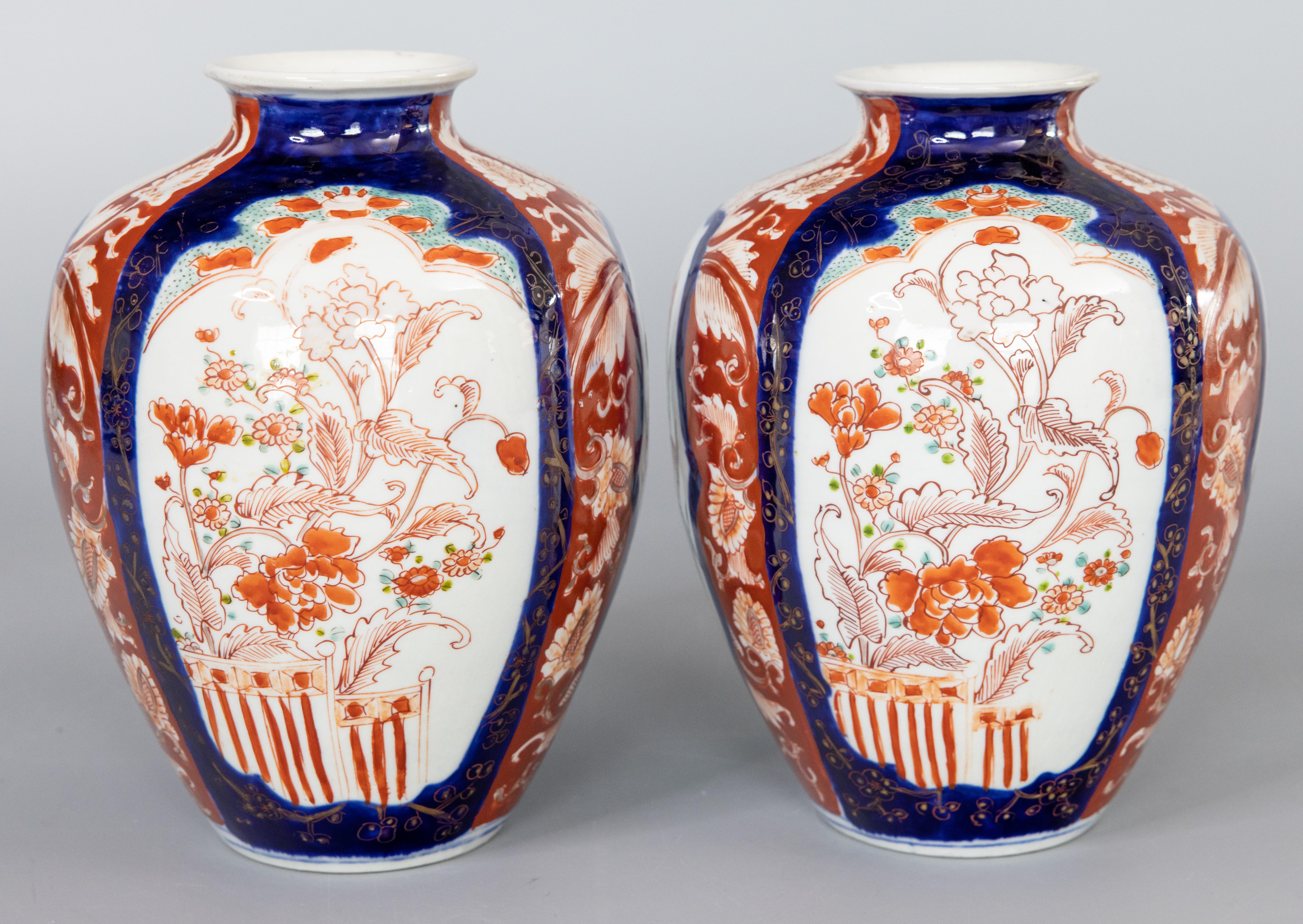 A gorgeous pair of 19th-Century Japanese Imari porcelain vases. These fine vases have a lovely shape and hand painted floral design in the traditional Imari colors. They are in beautiful antique condition and would be fabulous for