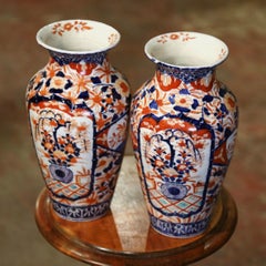 Pair of 19th Century Japanese Porcelain Imari Vases with Floral and Plant Decor