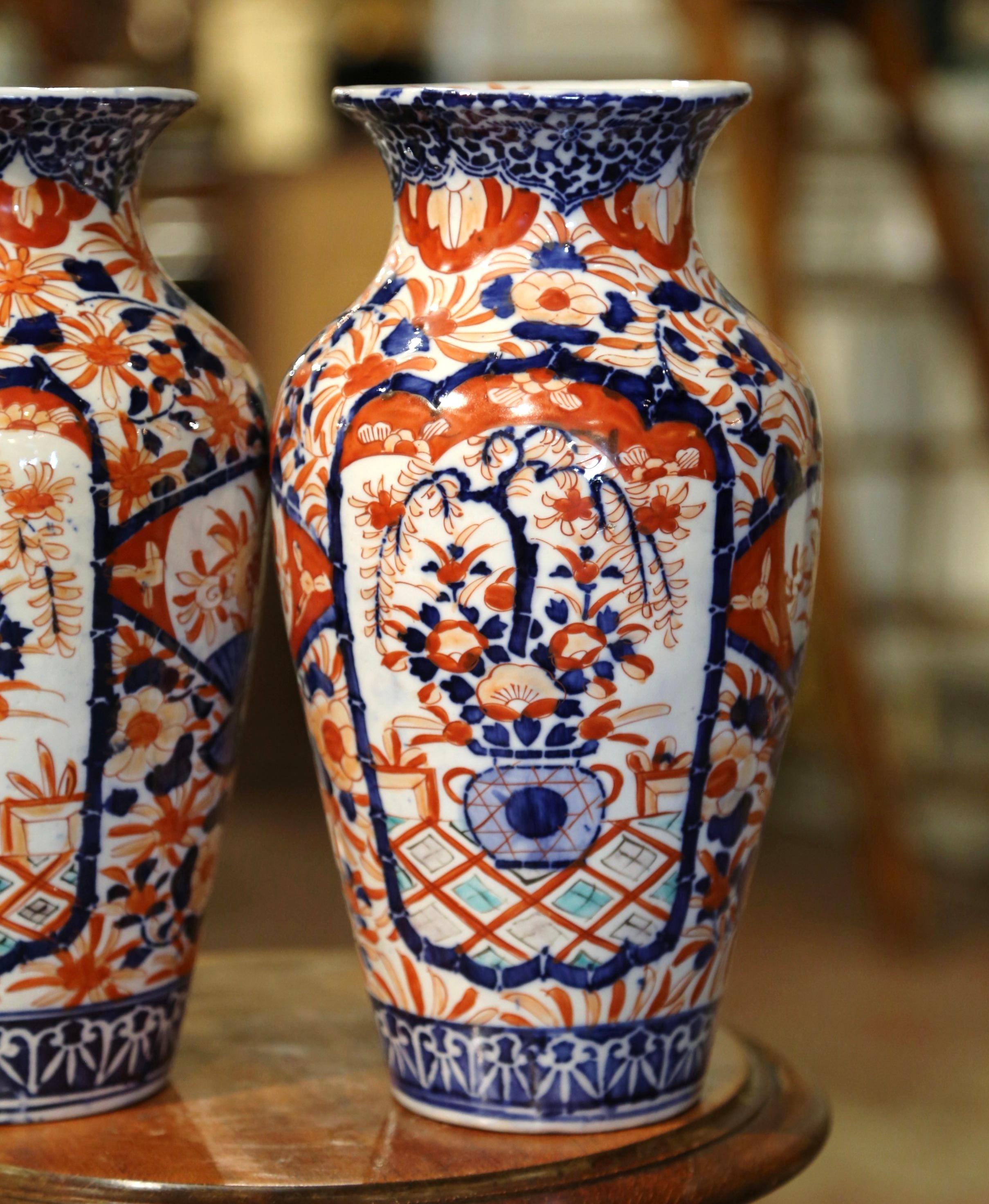 Pair of 19th Century Japanese Porcelain Imari Vases with Floral and Plant Decor In Excellent Condition For Sale In Dallas, TX