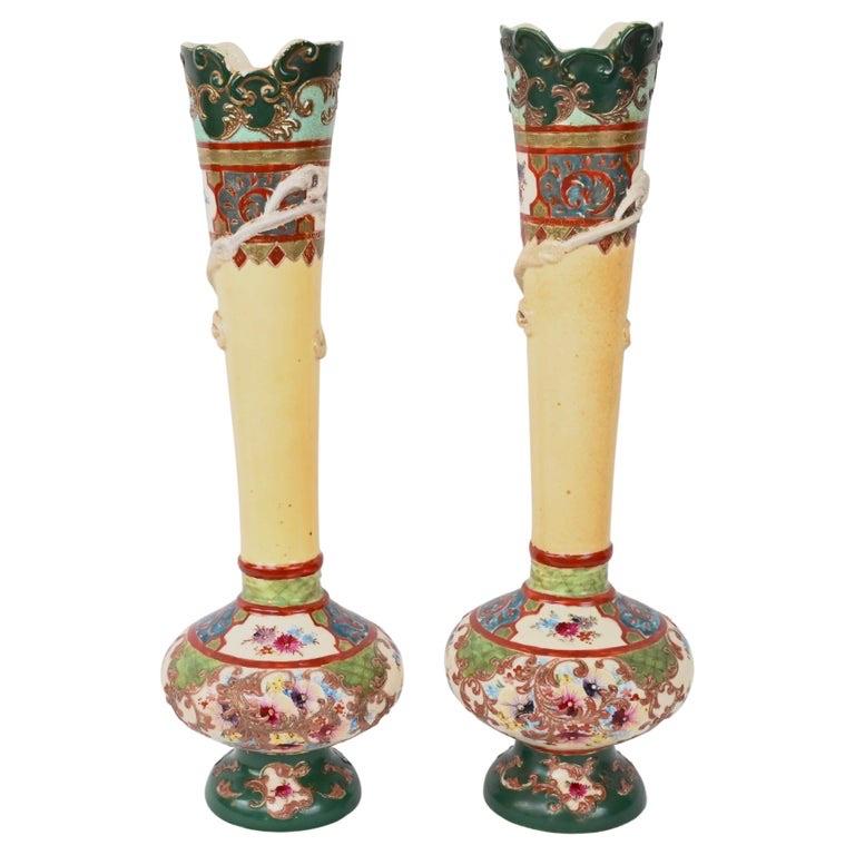 Rare and magnificent Pair of Japanese Enameled Porcelain Vases Imperial Meiji Style. This unique pair of antique hand-crafted and hand-painted vases have outstanding high relief details.

Scalloped rim, decorated with radiating colors, featuring