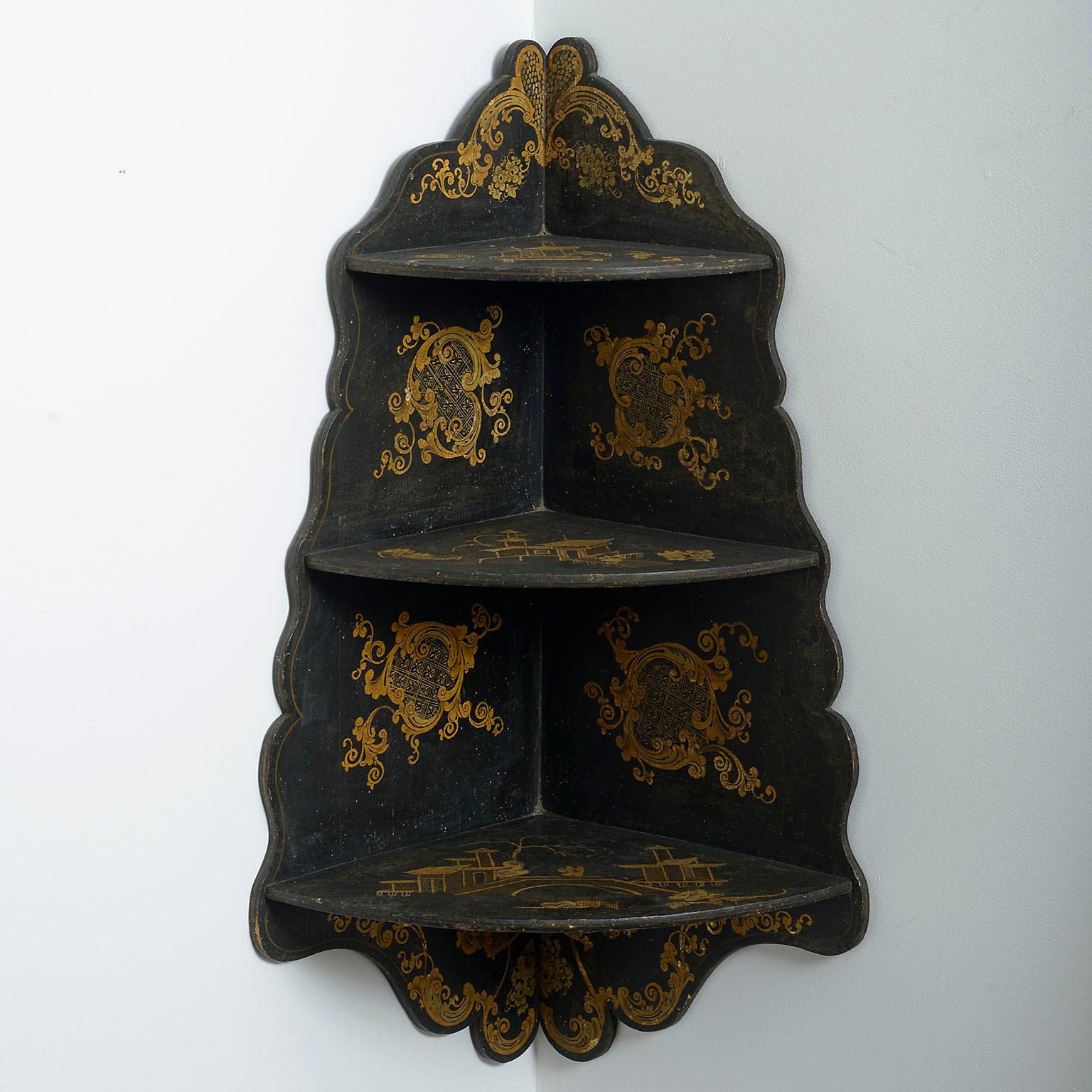 A pair of mid-nineteenth century black japanned hanging shelves, the fret cut frames each with three shaped shelves with gilt decoration throughout.

Circa 1860 England

Dimensions: 10.5 W x 17 D x 29 H inches
26.5 W x 44 D x 73 H cm