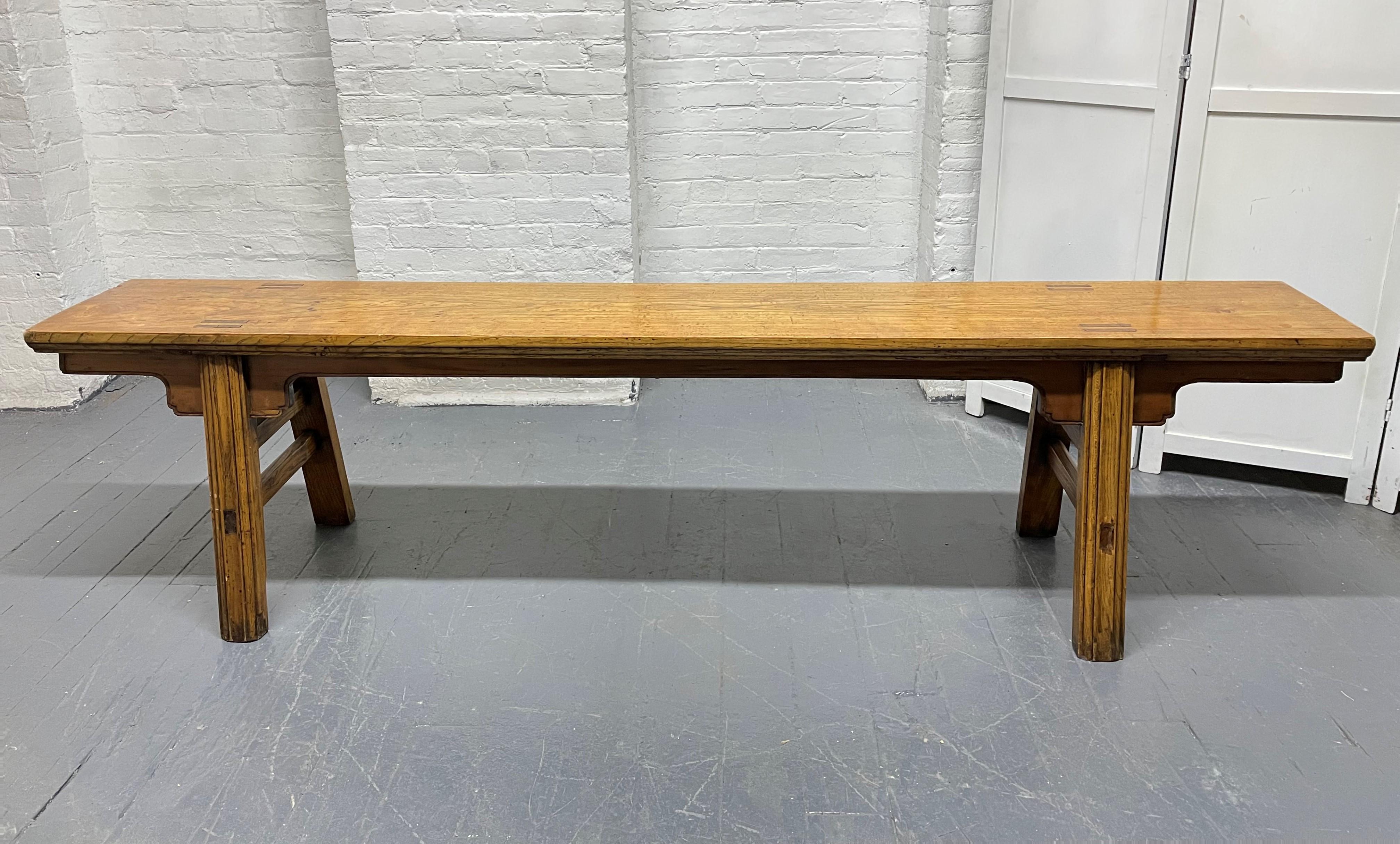Pair of 19th century long elmwood Asian benches. Measures: 84