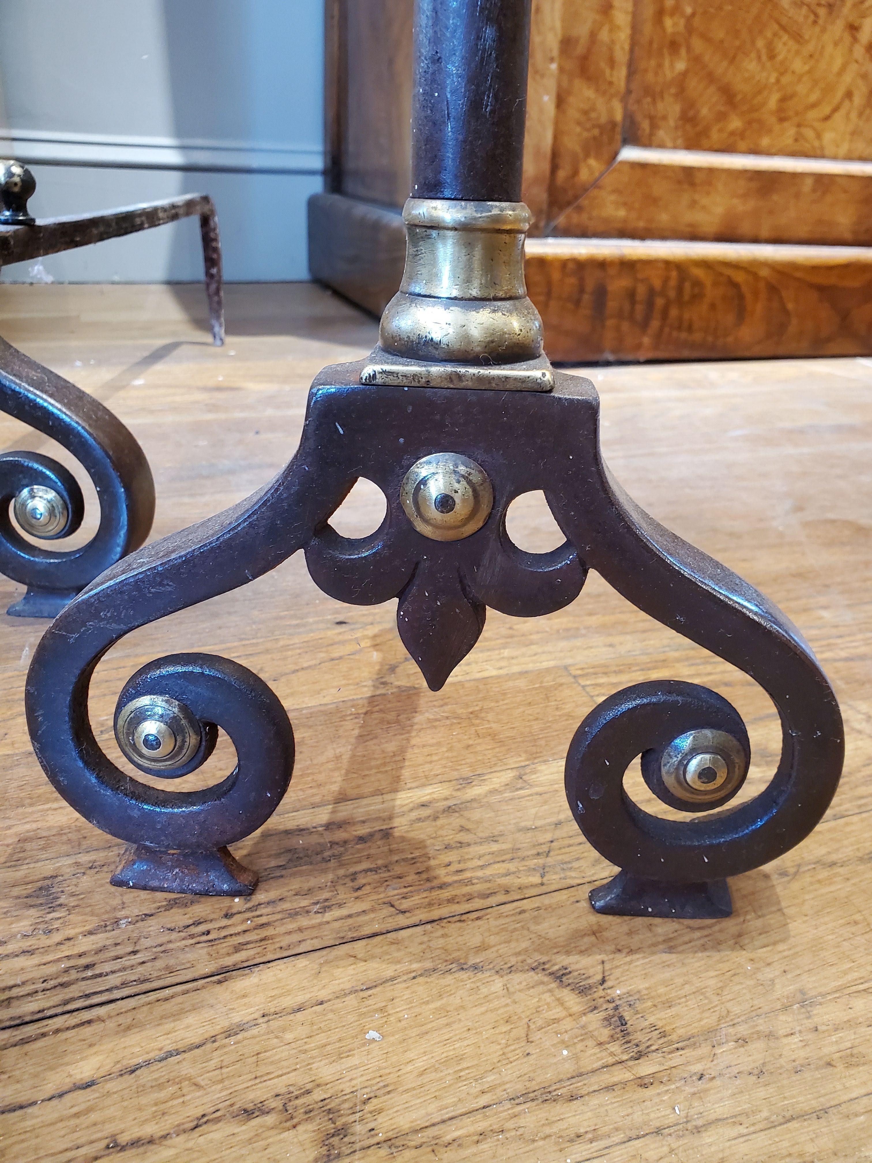 Excellent pair of 19th century Louis XIV style French provincial andirons made of burnished steel with brass finials and decorative details including scrolled feet.
South of France, circa 1880.
Measure: 23” H, 9” W, 22” D.