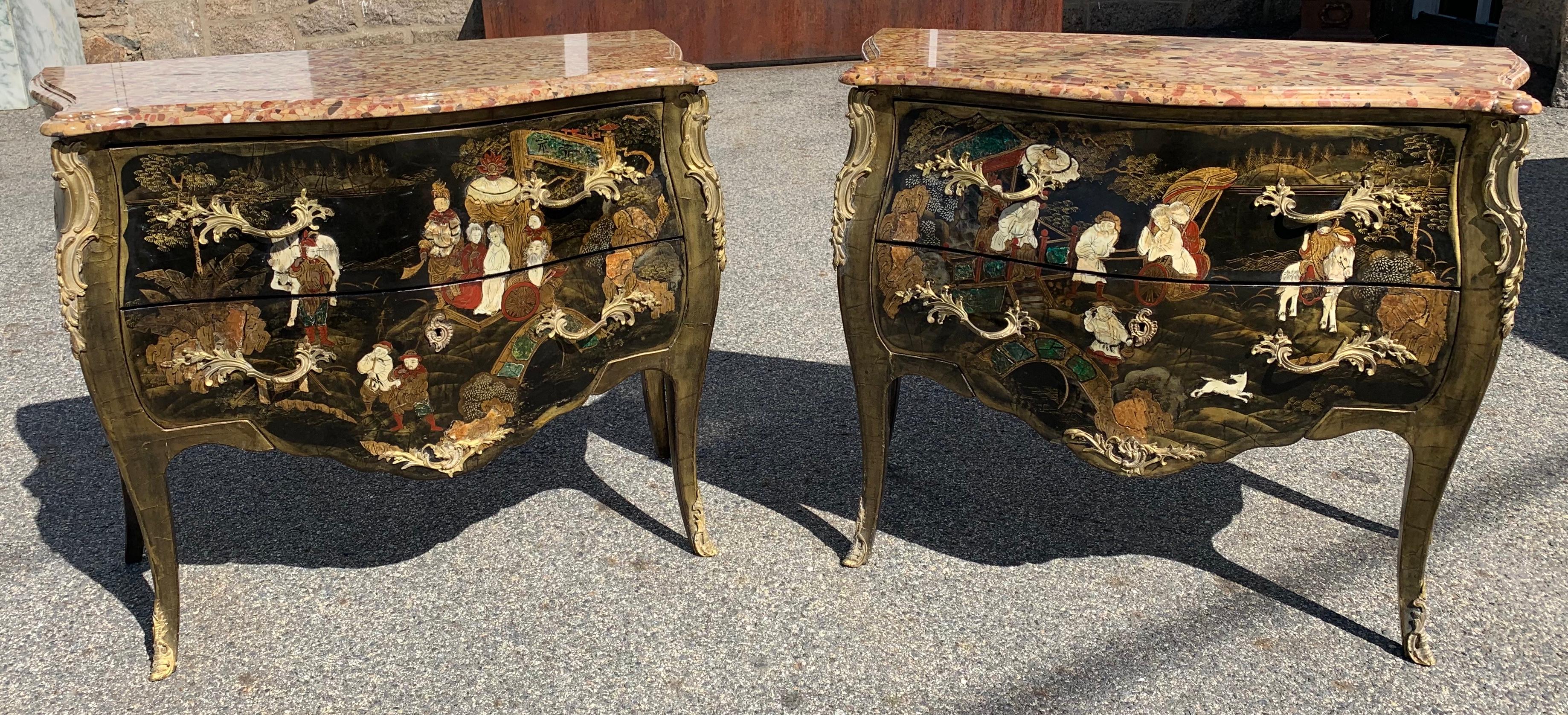 Pair of 19th century Louis XV Style chinoiserie or Japanned bombe commodes with original marble tops
Ormolu Mounts and beautifully executed Chinoise scenes of figures, horses, butterflies and flowers in lacquer, mother of pearl and bone. Colors are
