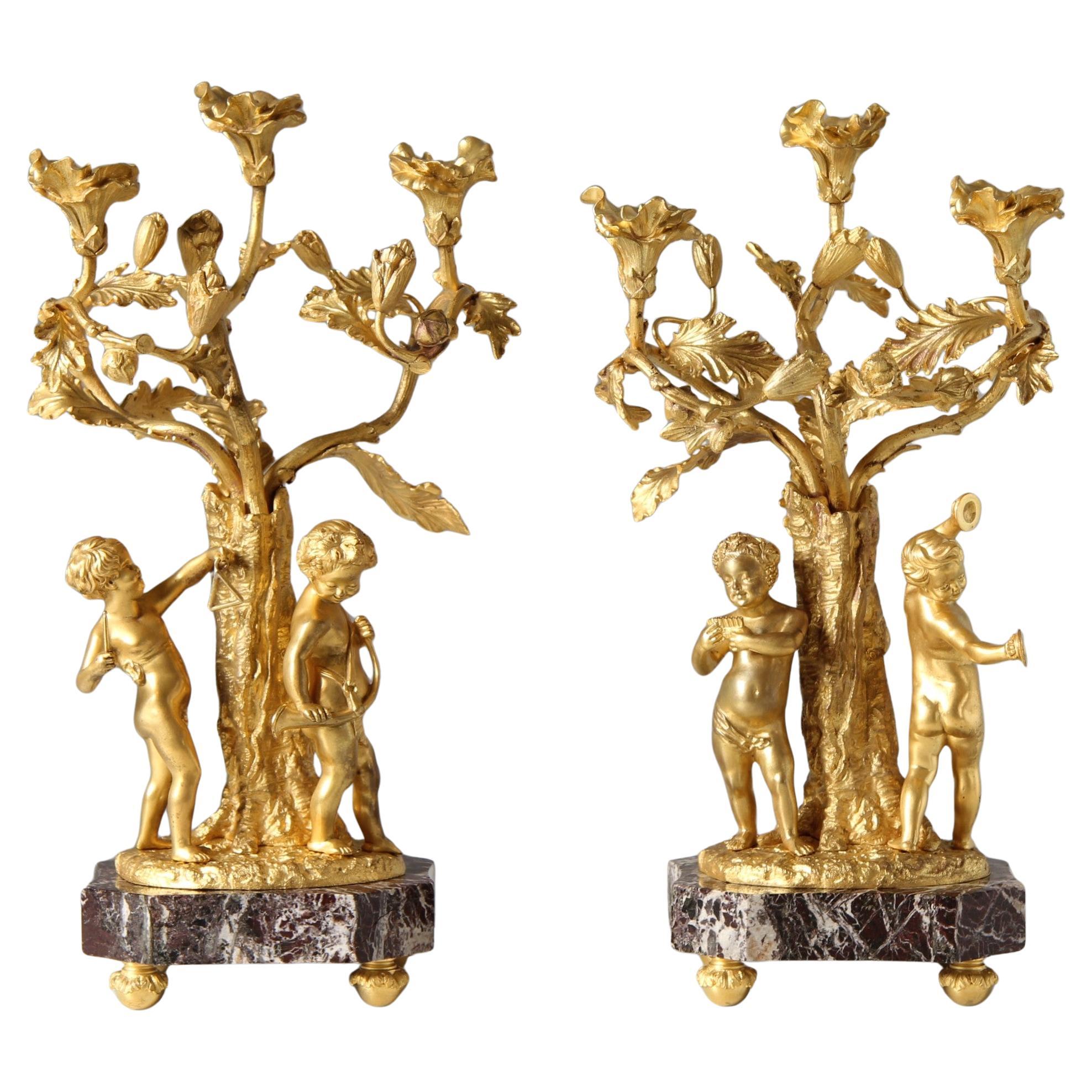 Pair of 19th Century Louis XV Style Ormolu Candelabras with Musical Cherubs For Sale