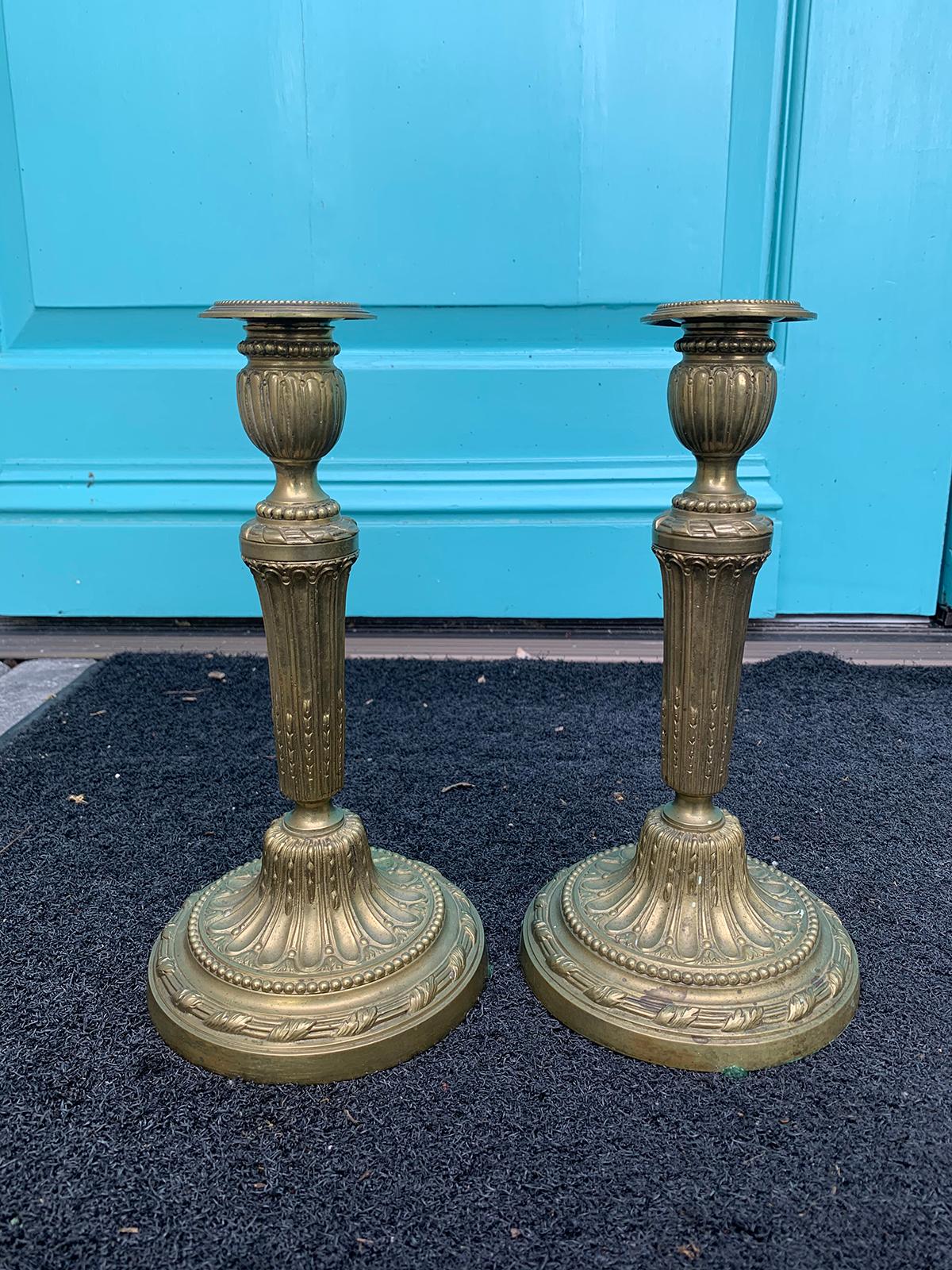 Pair of 19th century Louis XVI style bronze candlesticks.