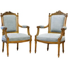Pair of 19th Century Louis XVI Style Carved Giltwood Upholstered Open Armchairs