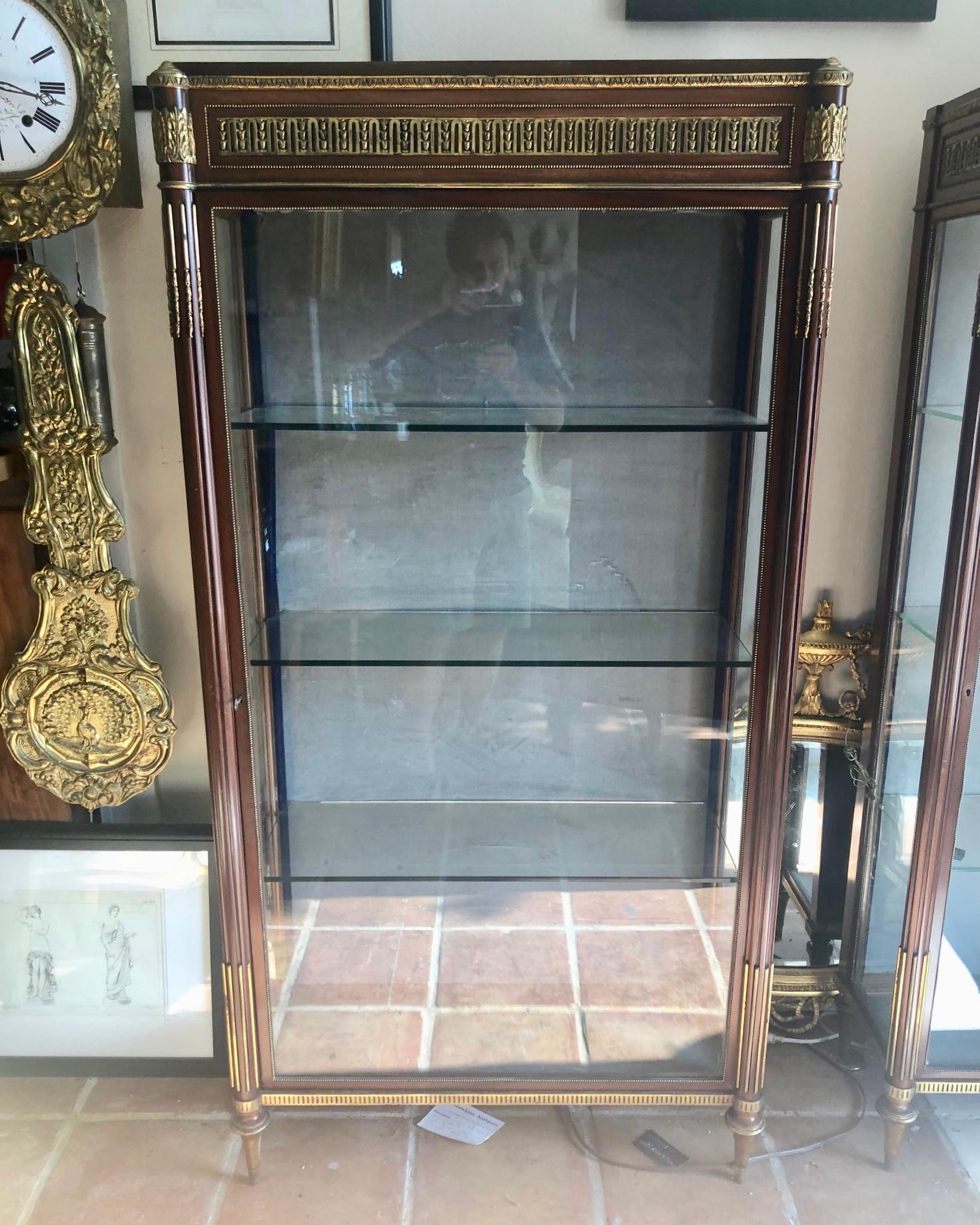 These are a superb pair of French display cabinets of the highest quality.
Lovely ormolu all-over the cabinets.
They sit on small turned legs and have 3 glass shelves inside.
It’s a very deep rich mahogany far nicer than the picture shows.
They