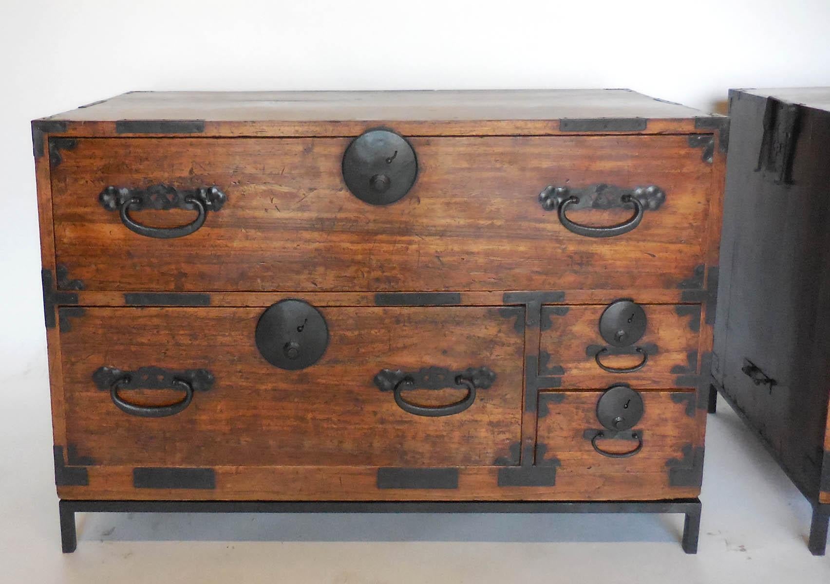 Pair of 19th century Japanese tansus on custom iron bases. Sold as a pair. All original hardware, bamboo nail. Functional drawers and door. Beautiful patina. Very functional as nightstands. In very good condition.