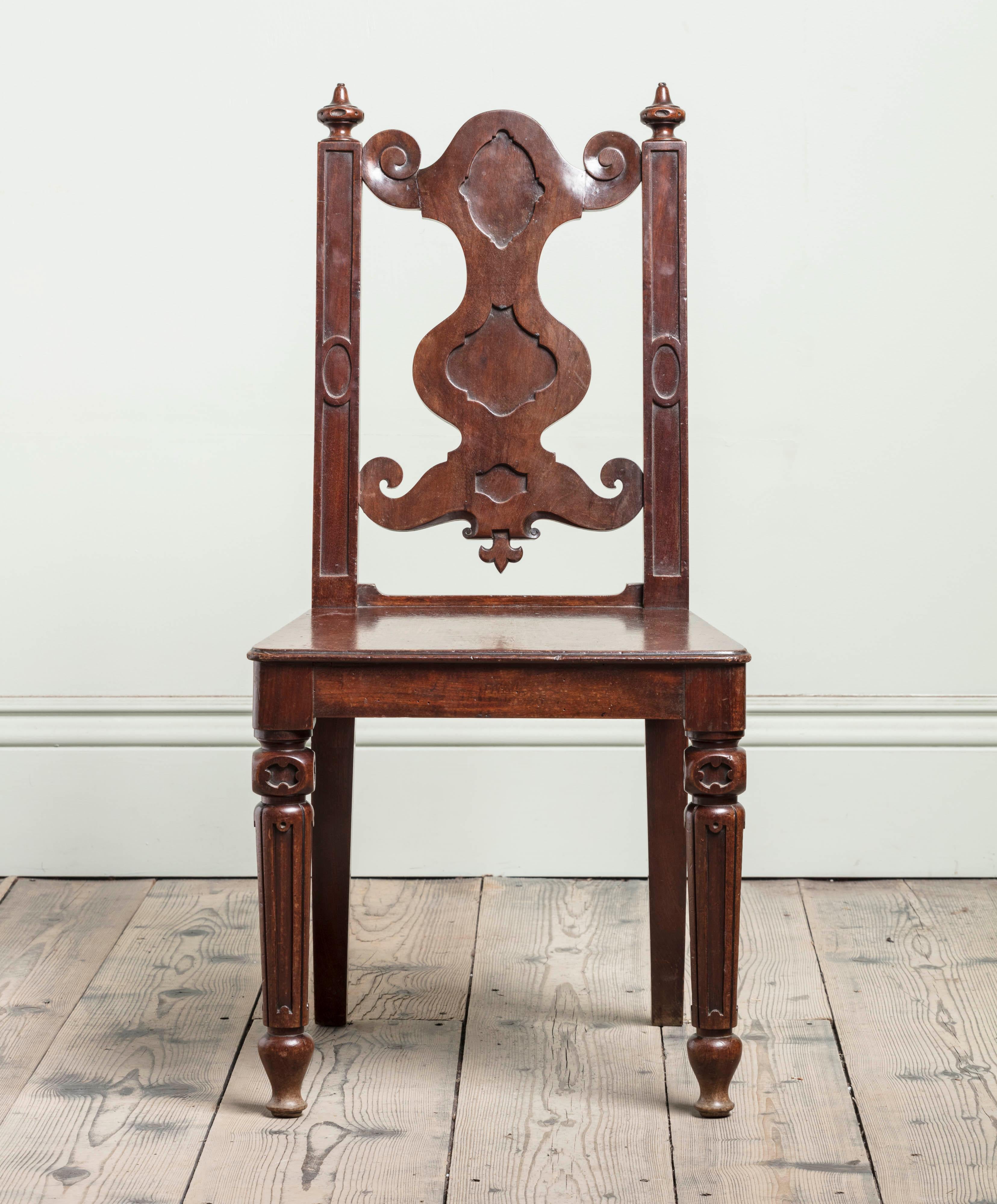 A Pair of 19th Century Mahogany Elizabethan Revival Hall Chairs, in the Manner of Bridgens

Height: 94 cm, 37″
Width: 46 cm, 18 1/8″
Depth: 51 cm, 20 1/8″