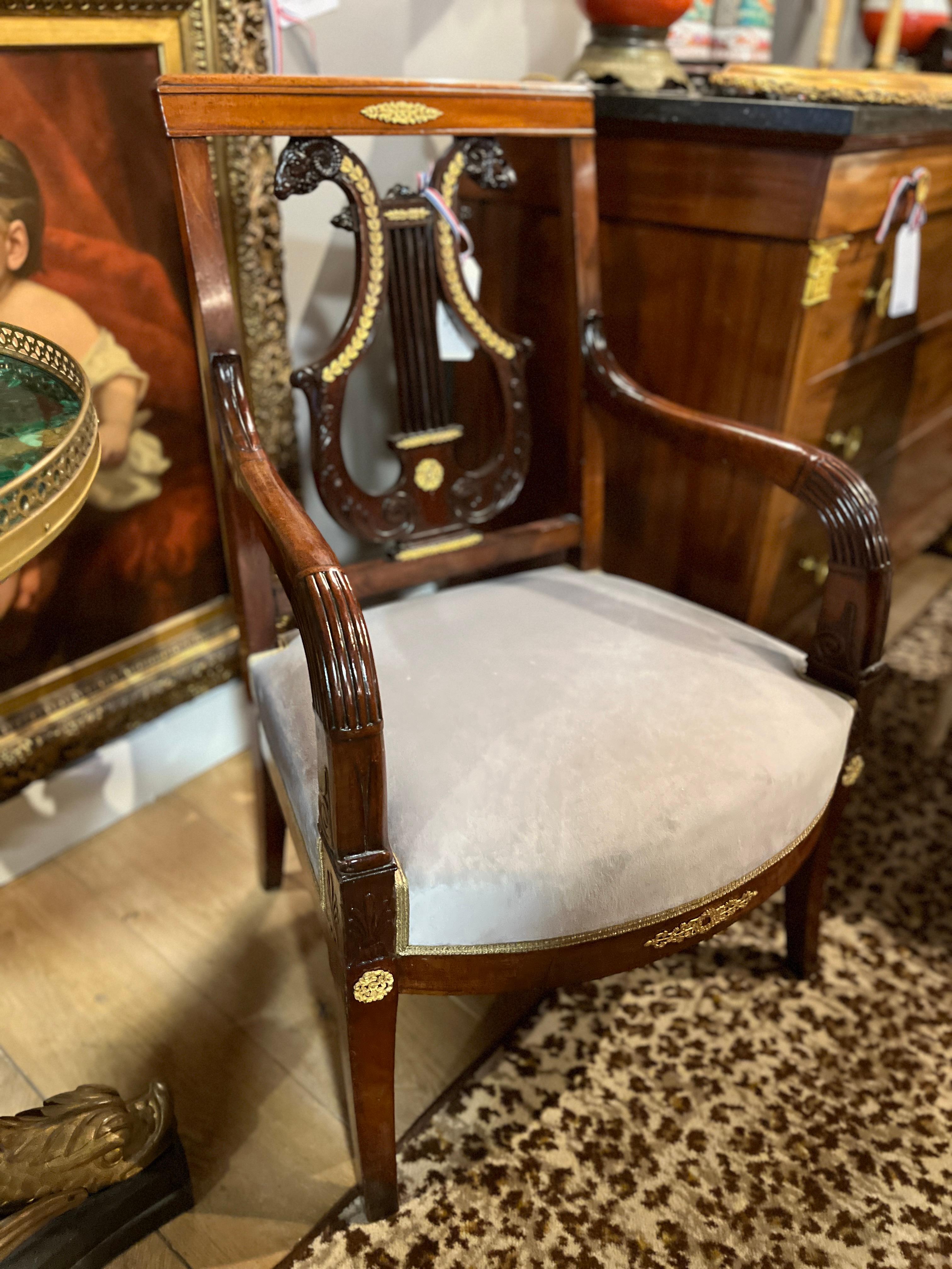 Pair of 19th Century Mahogany French Regence Library Chairs with Lyre back and gilded accents. gorgeous shape.