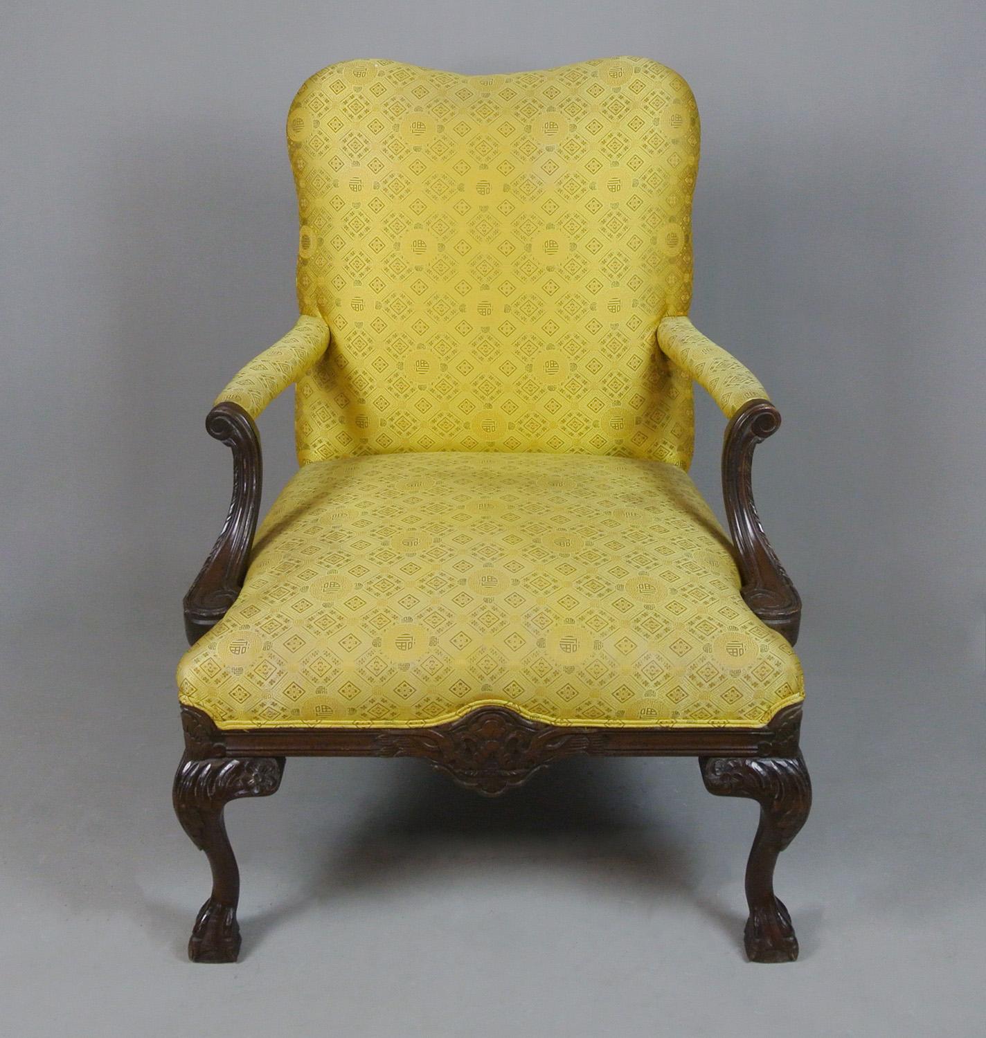 A very good quality pair of 19th century chairs with well carved cabriole legs to front and back, serpentine shaped backs and lovely scrolled and outswept arms on channel carved supports.

The chairs are upholstered in a gold Chinese pattern silk