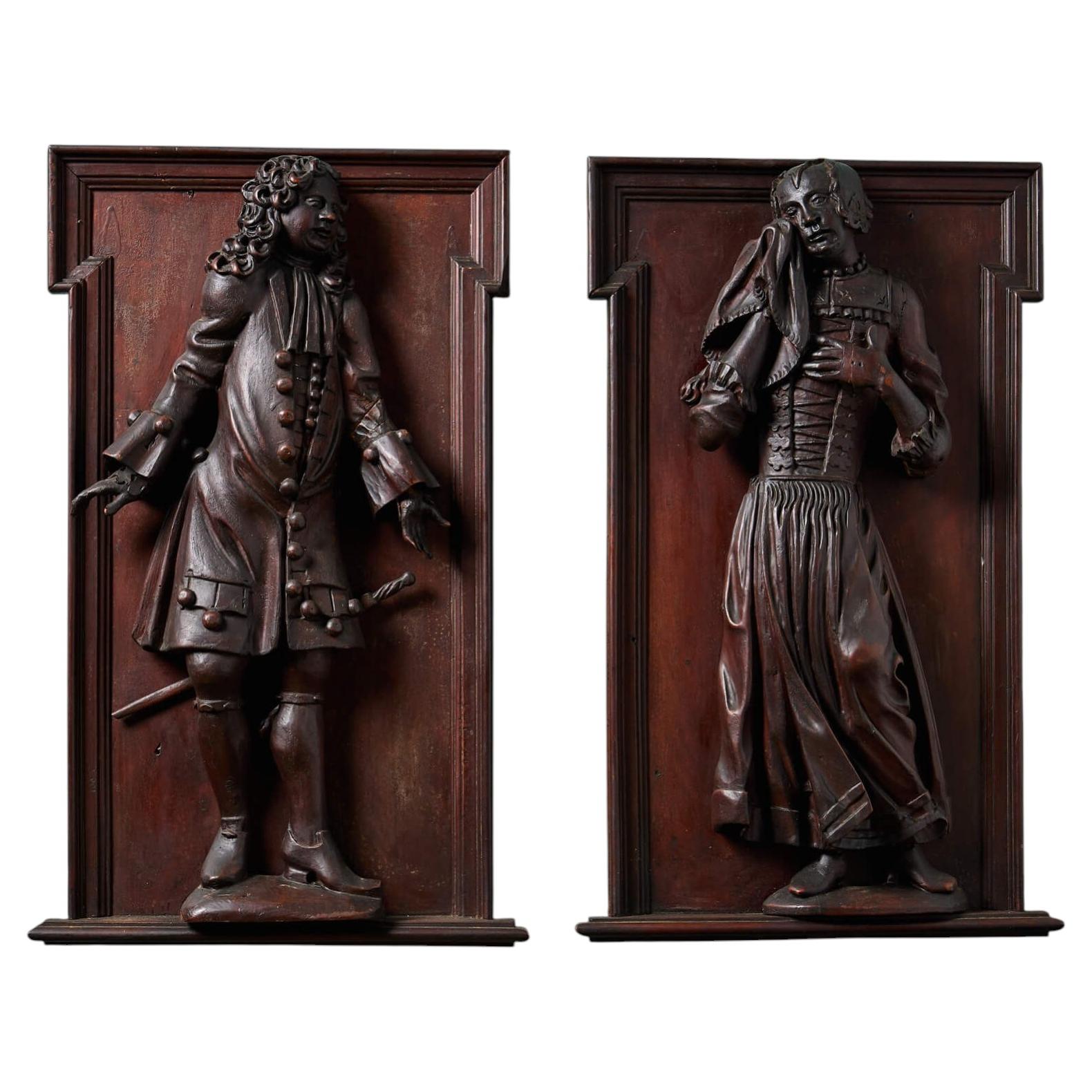 Pair of 19th Century Mahogany Relief Carvings of 18th Century Figures For Sale