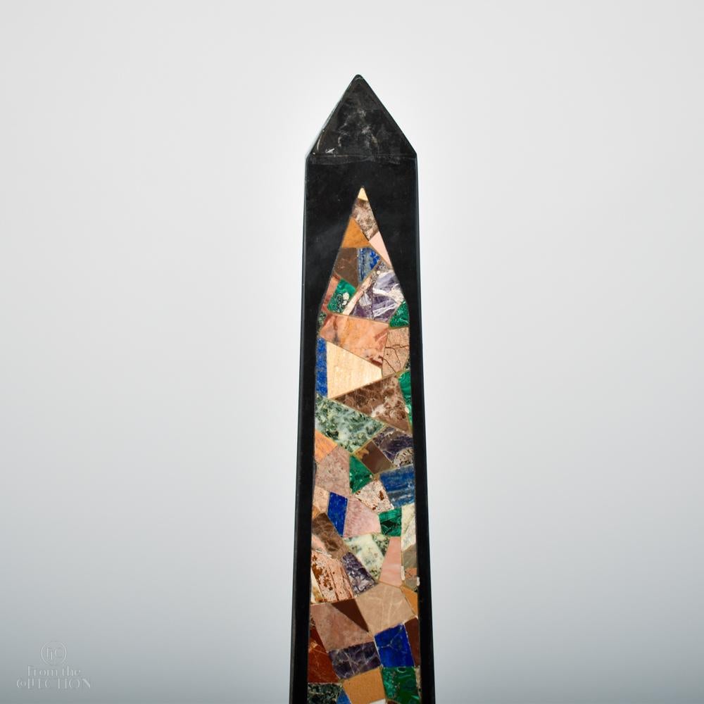 An unusually tall pair of marble obelisks from the 19th century are inlaid profusely with agates and semi precious stones set into slate. Their exceptional height (125cm) lends them to be floor standing, coupled with the fact they come as a pair,