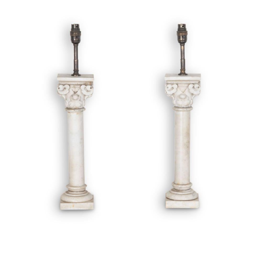 Pair of 19th Century French carrera marble corinthian columns rewired into stylish table lamps. 

They measure 37cm tall plus brass fitting makes them 52cm. Rewired and PAT tested to UK standards.
