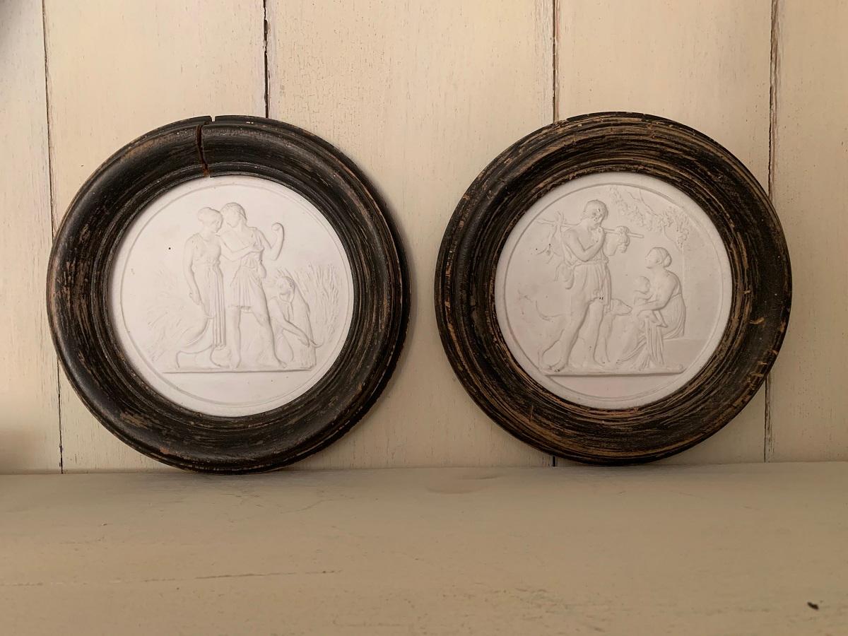 A pair of 19th century medaillon ceramique camée plaques depicting mythologically the hunt and the harvest which refers to the fall and autumn.