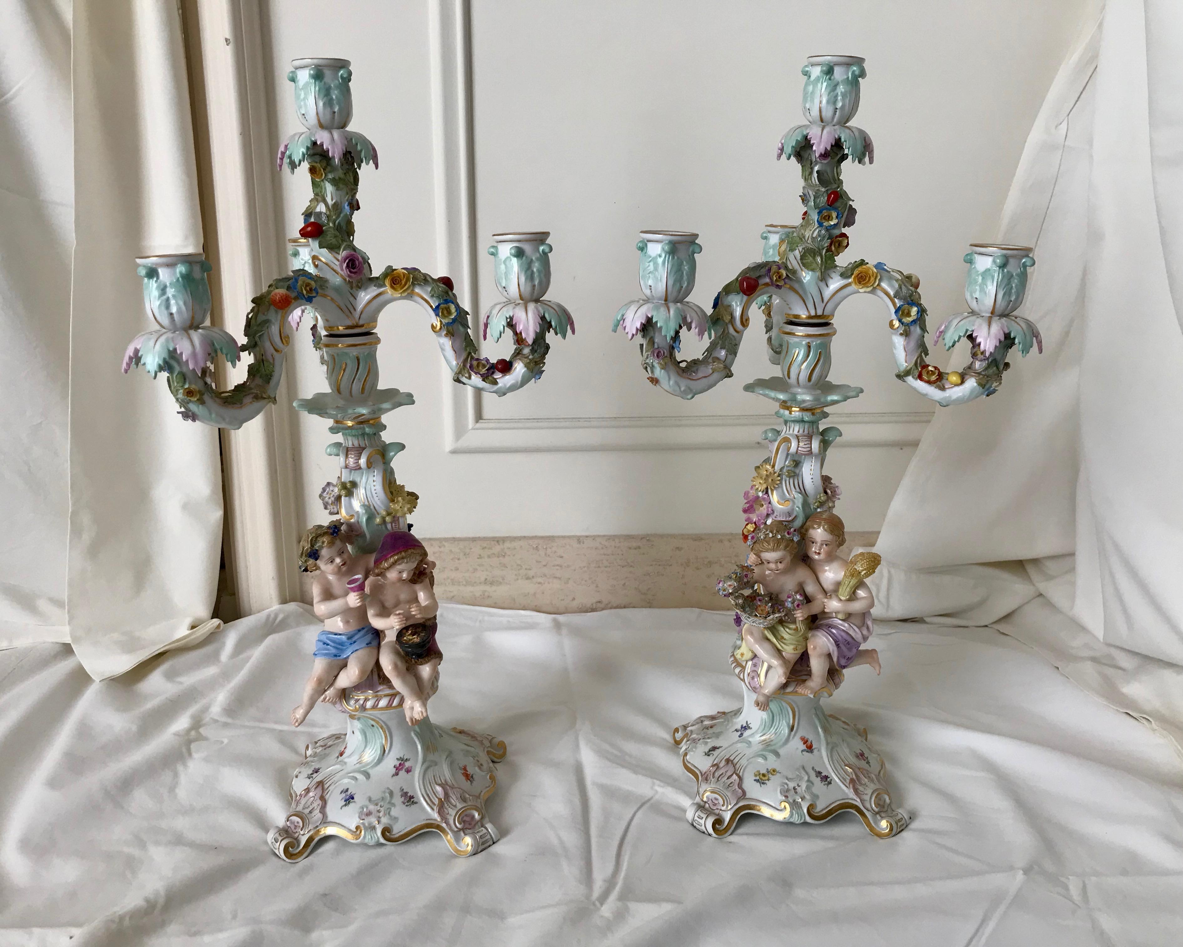 A fine and proper pair with 2 seated children gracing each candelabrum -
one pair facing right - the other children facing left. All are different.
Exquisite quality and detail. Each candelabrum holds 3 candles .
Superior quality.