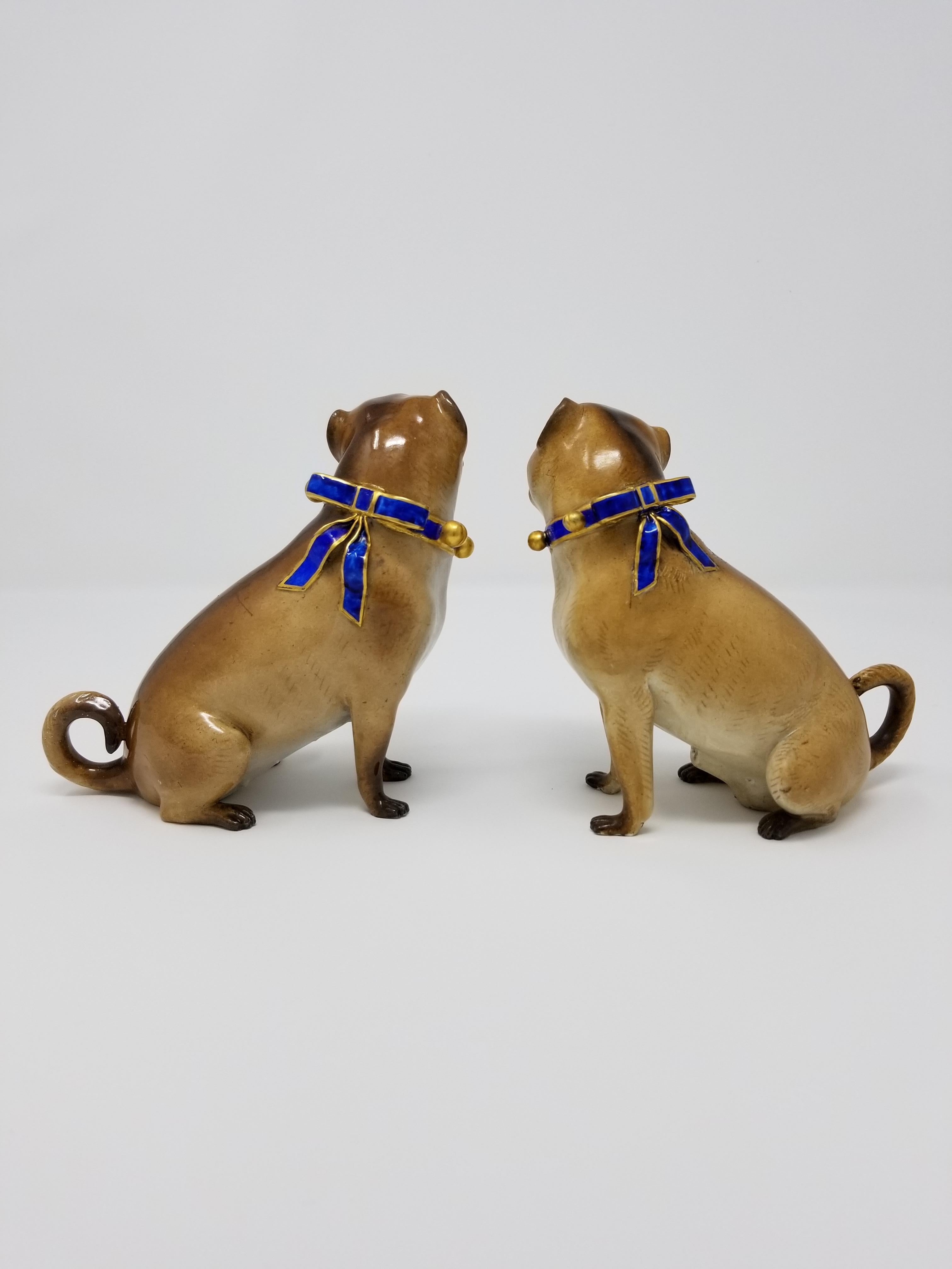 A beautiful pair of 19th century Meissen Porcelain figures of pug dogs with gilt bell collars. Each pug is exceptionally hand-carved and hand-painted to seem as realistic as possible. With a beautiful multi-toned brown overcoat fur and contrasting