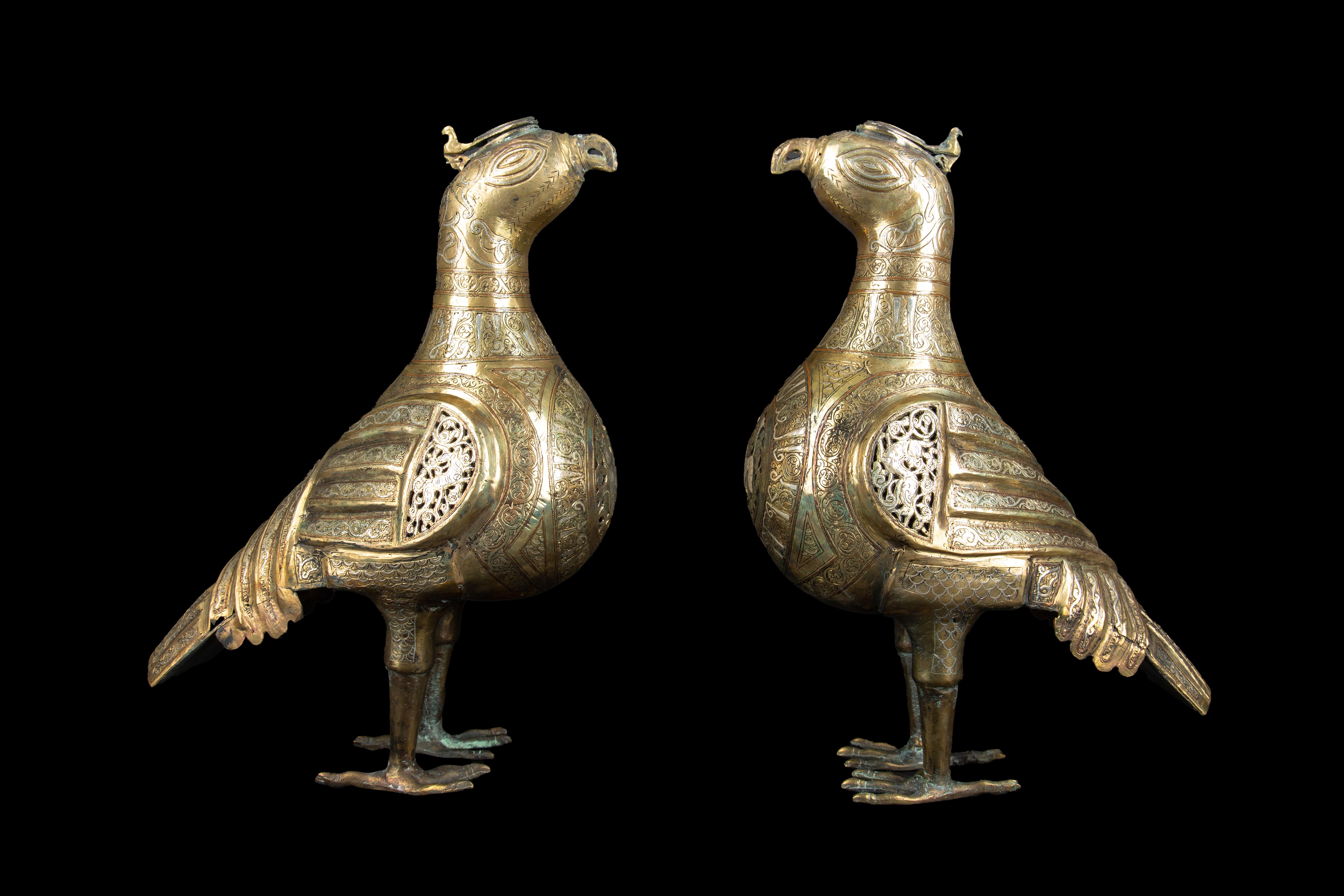 These bird-shaped incense burners were created in the 19th century in Khorasan, a province in northeastern Iran that has a rich history of Islamic art and culture. The burners are made of a mixture of bronze, silver, and copper, which were commonly