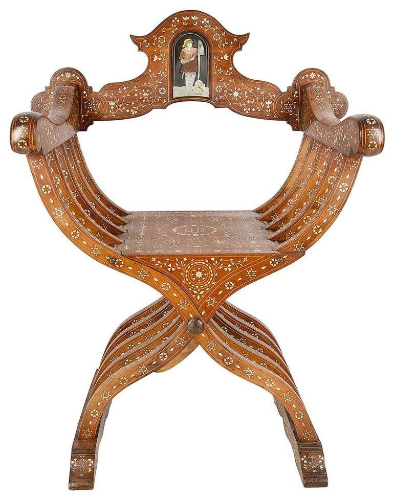 A good quality pair of 19th century Italian, Milanese Savonarola Moorish influenced armchairs. Each with wonderful inlaid, bone, ebony, pewter and copper decoration.

SA VEKZZ