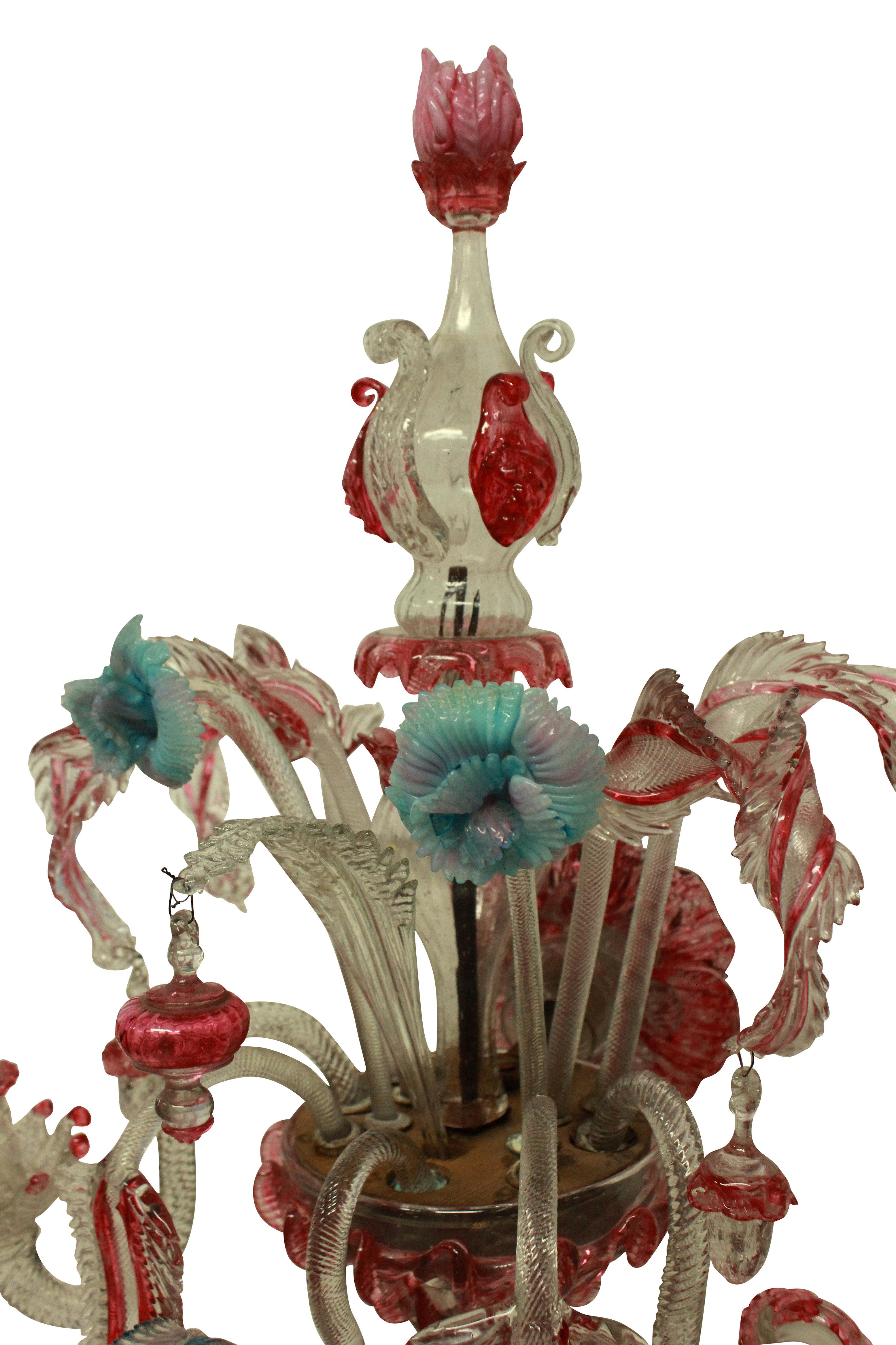 A pair of colorful Murano glass wall sconces, with leaves and flower. These have not been electrified and there are historic losses to the glass.