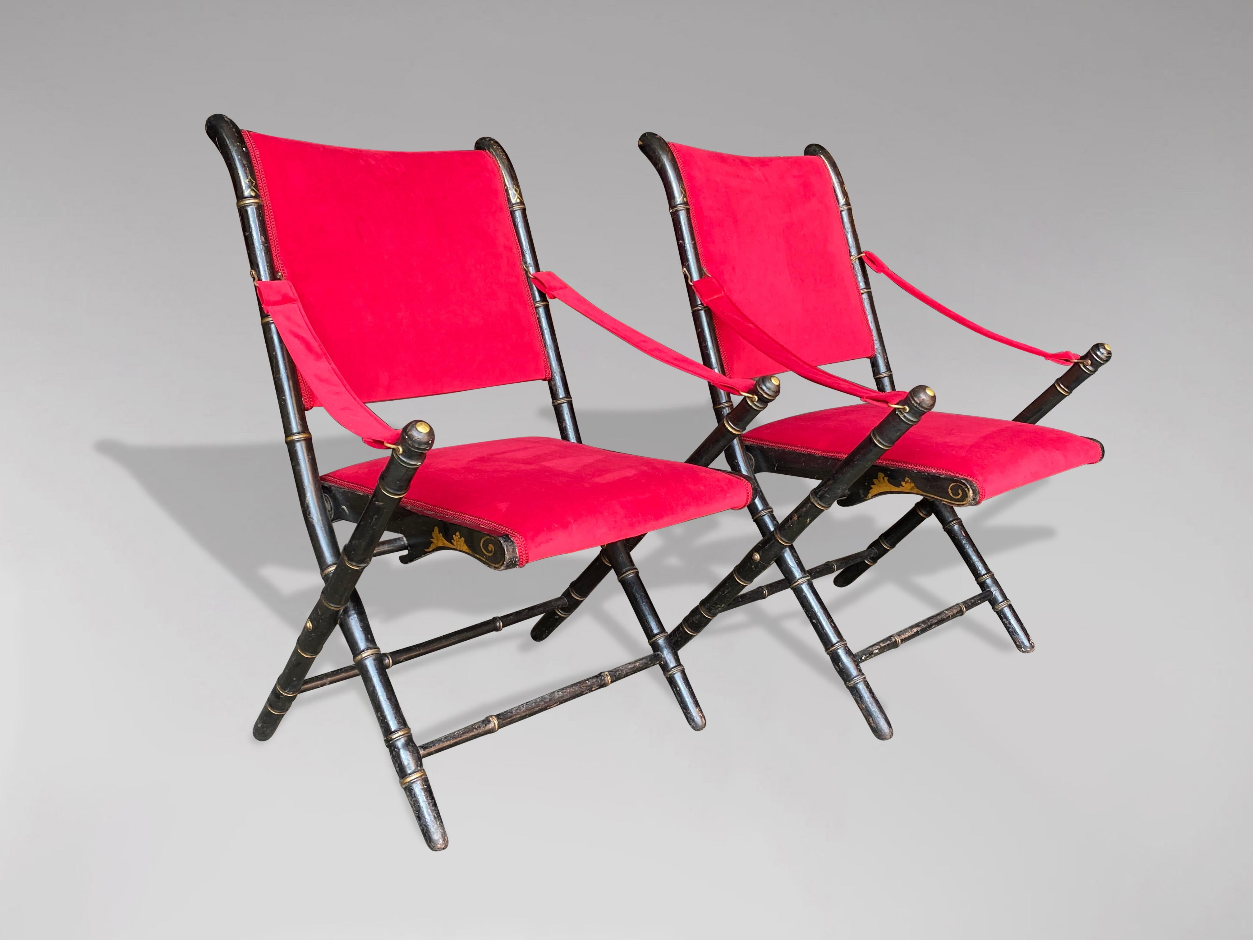 A pair of 19th century folding armchairs in carved and blackened wood in the imitation of bamboo with gold palmettes decorations. Reupholstered in red velvet. Napoleon III period. Labelled Phelippeau Tapissier of Paris.

The dimensions