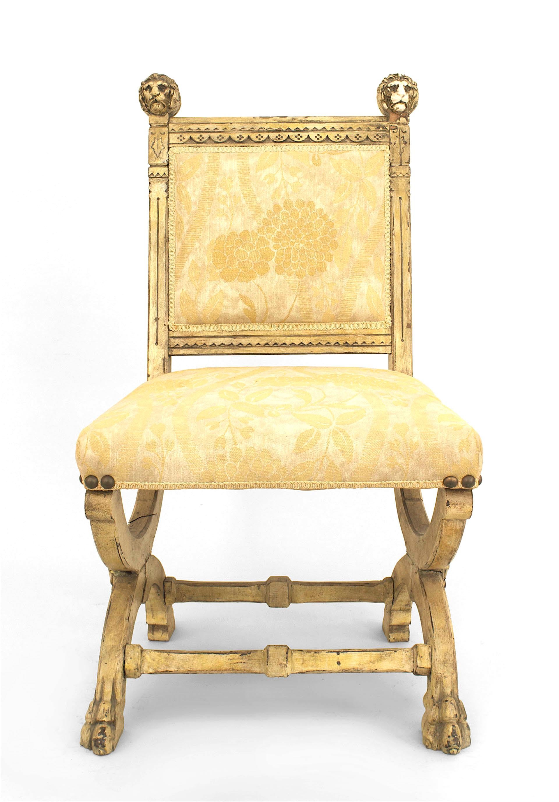 Pair of English Victorian (Aesthetic Movement) painted side chairs with lion head finials on back with and upholstered seat and back and front stretcher
