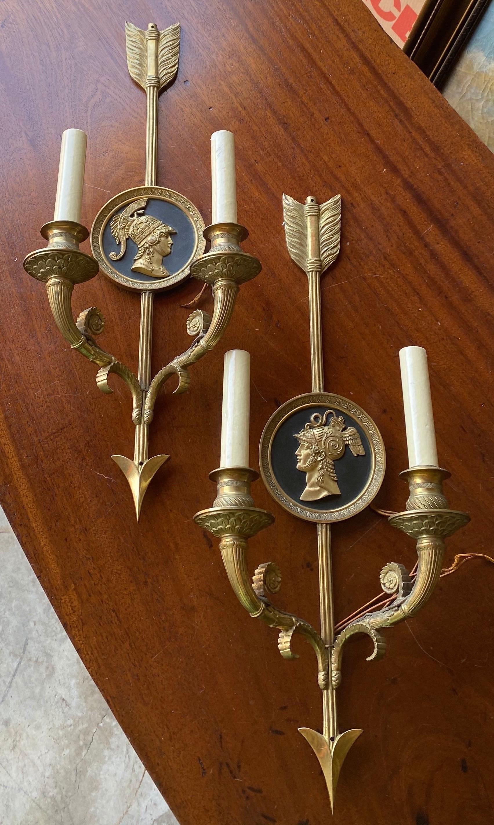 Great pair of 19th century neoclassical style 2 light sconces with bookmatched medallions of Roman soldiers.