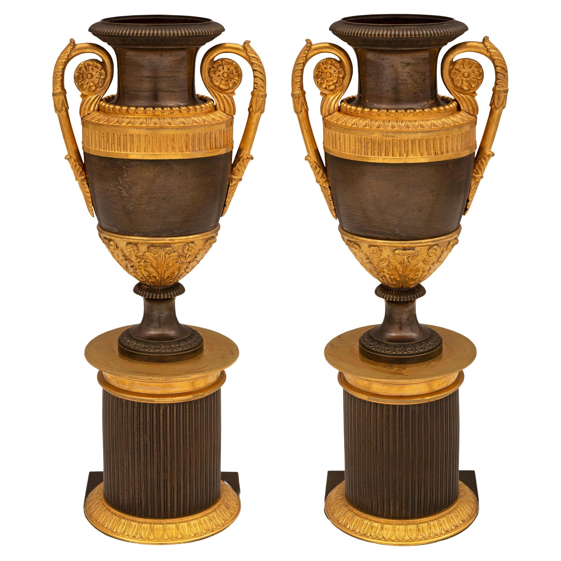 Pair of 19th Century Neoclassical Style Patinated Bronze and Ormolu Urns
