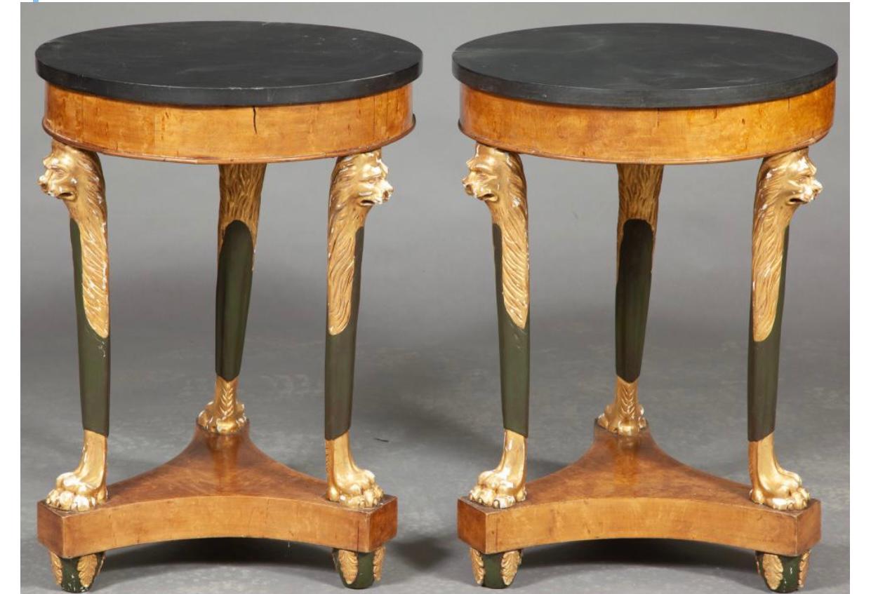 Pair of continental Karelian Birch, faux bronze and parcel-gilt gueridons
Possibly Russian
Each circular slate top above a plain frieze raised on tapering lion's-head monopodia joined by a tripartite plinth, on leaf-carved feet.

Provenance: